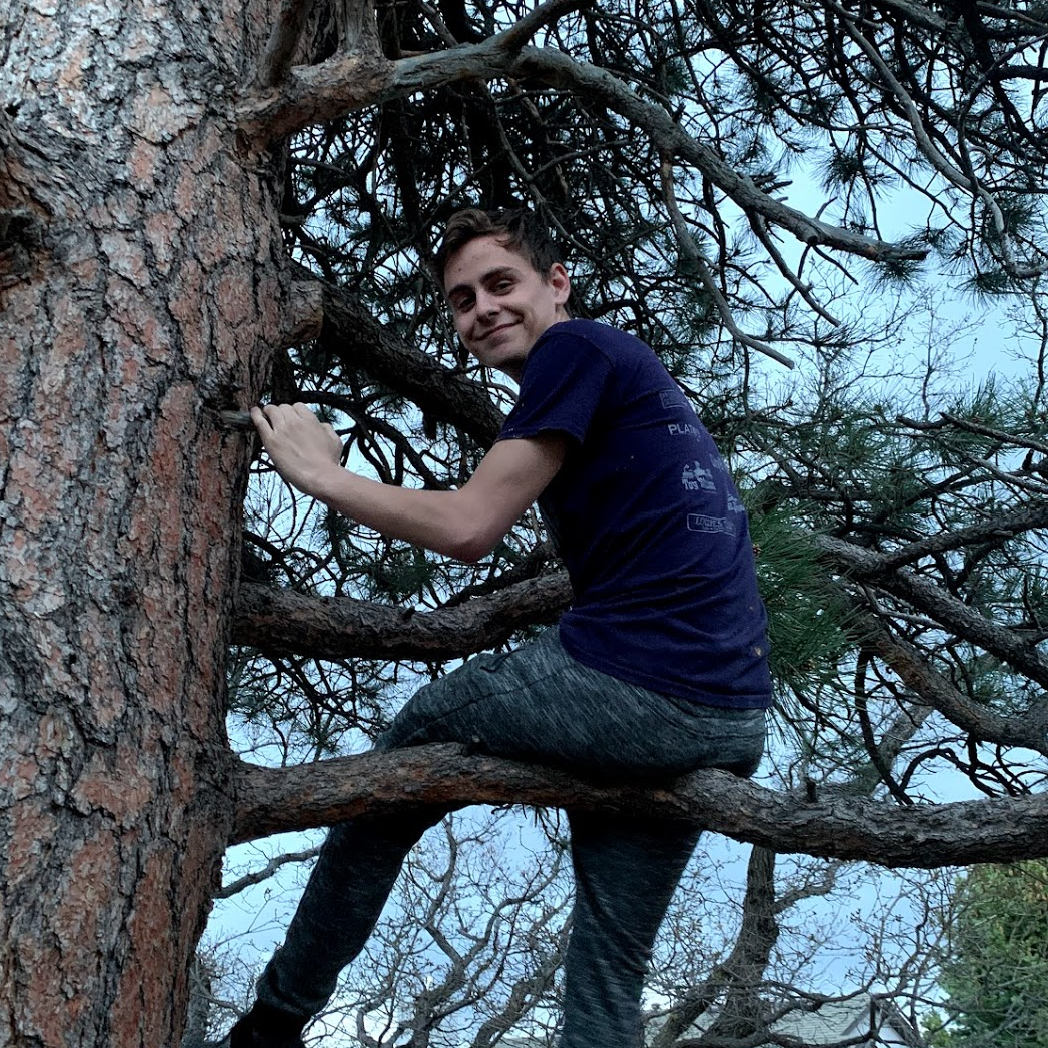 Noah, just a few minutes after we got engaged, looking at our initials we had carved into a tree years earlier. Look at that smug grin!