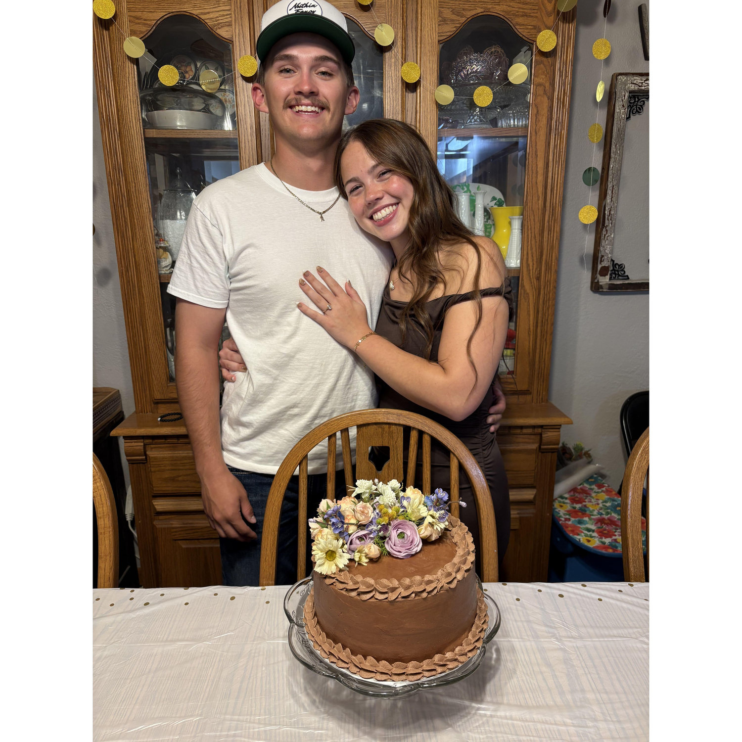 Us with our beautiful engagement party cake!