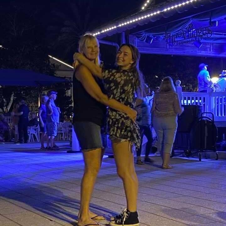 Sam’s mom and Paige slow dancing in Florida.