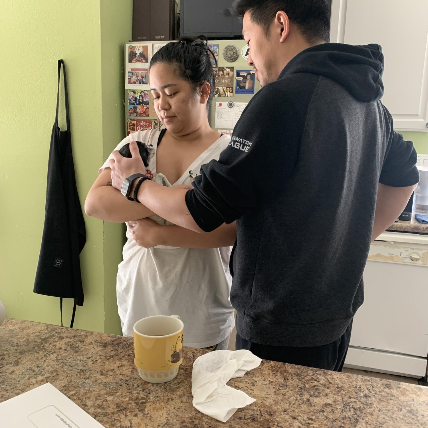 Holding and caring for our one and only doggie child Winchester.