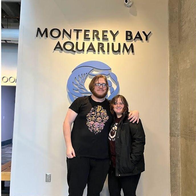Our date to the Monterey Bay Aquarium. It was raining so hard that we decided to go outside and enjoy it. An employee offered to take our photo right after we got ourselves soaked.
