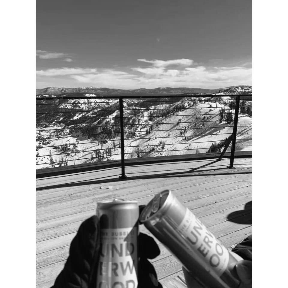 Champagne on the top of Olympic Valley to celebrate not breaking anything our first time snowboarding.