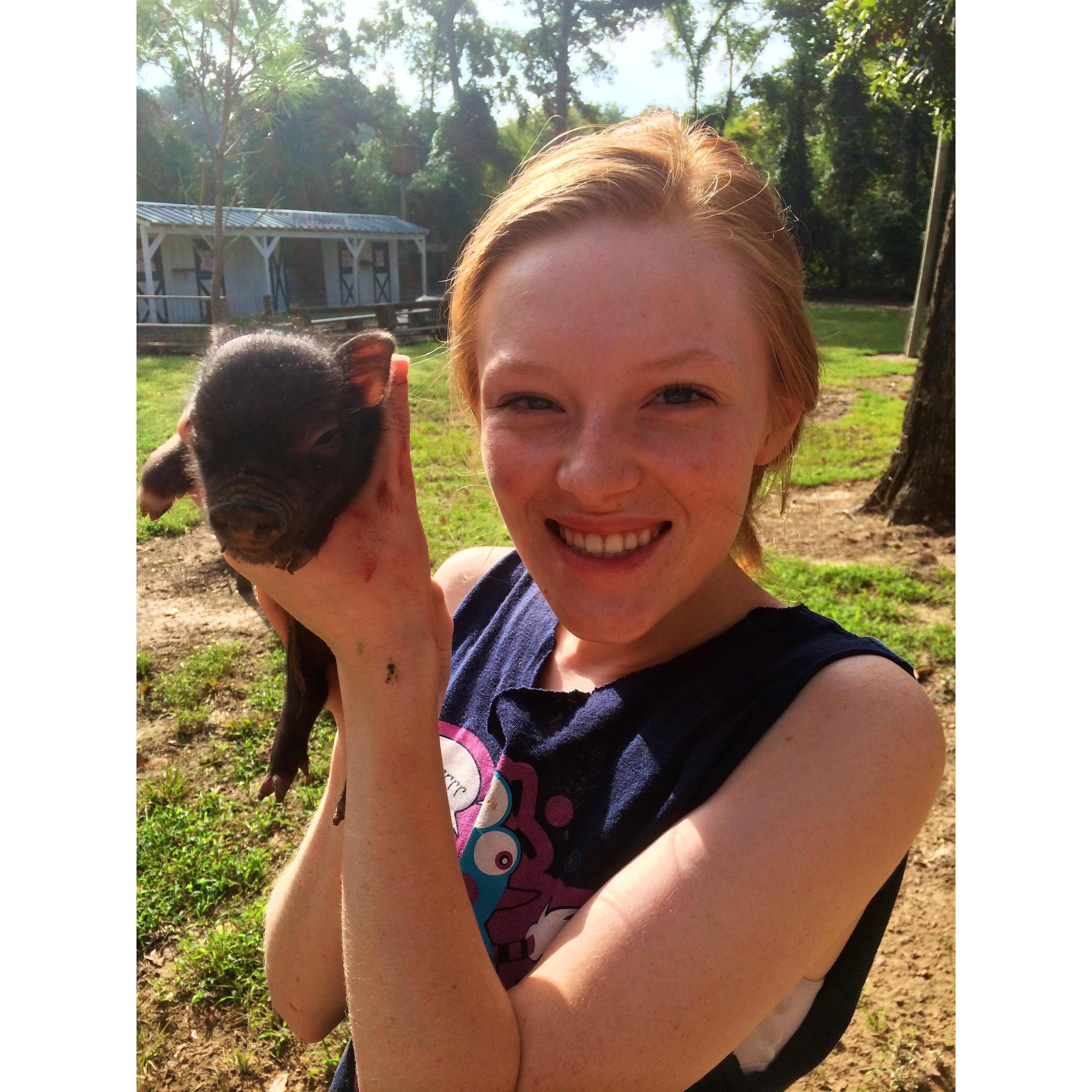 I think I was 17 or 18 here holding this little piglet at the Farm!