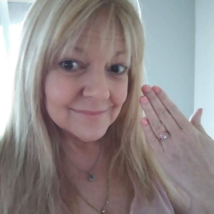 Showing off her engagement ring.... So beautiful