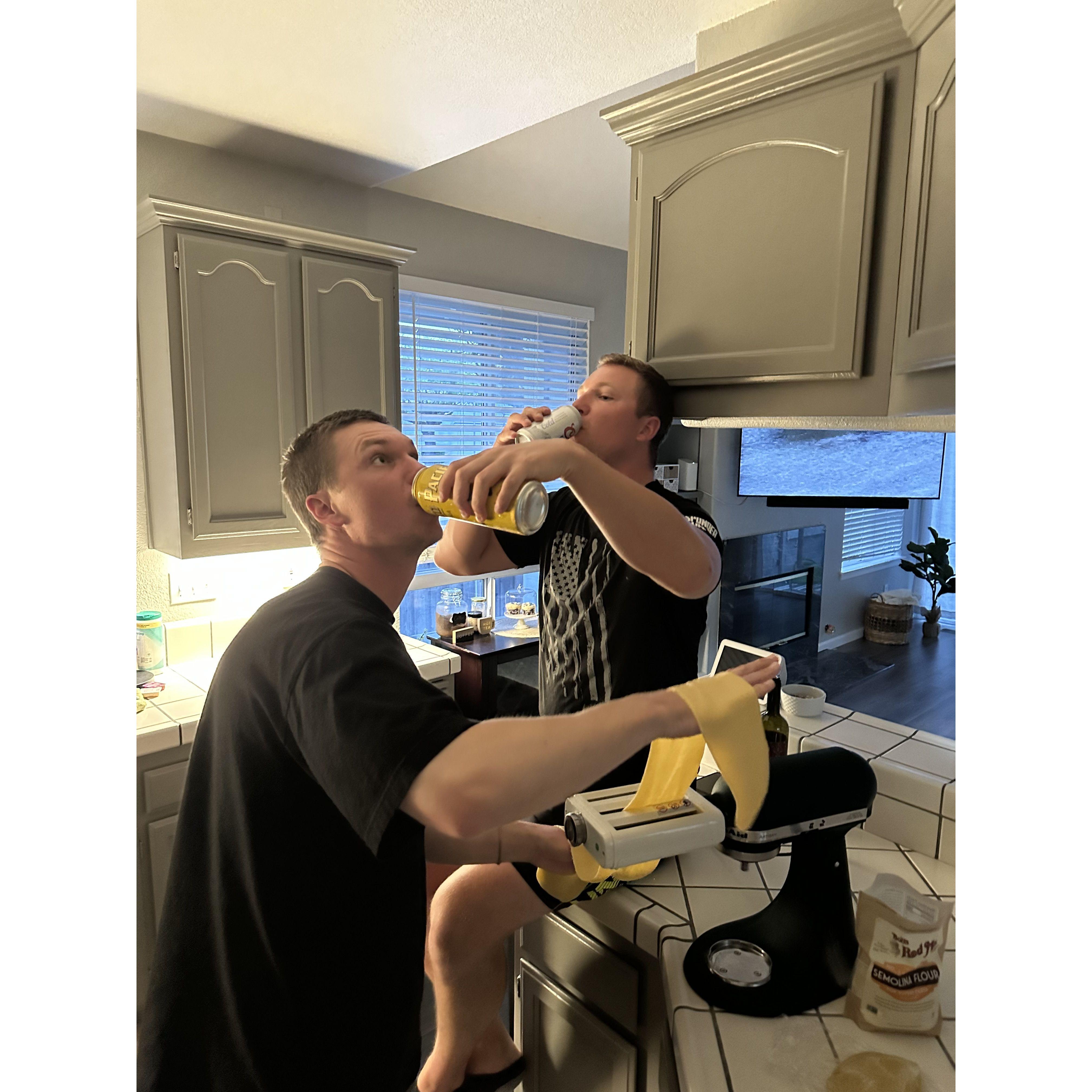 Brothers making pasta
