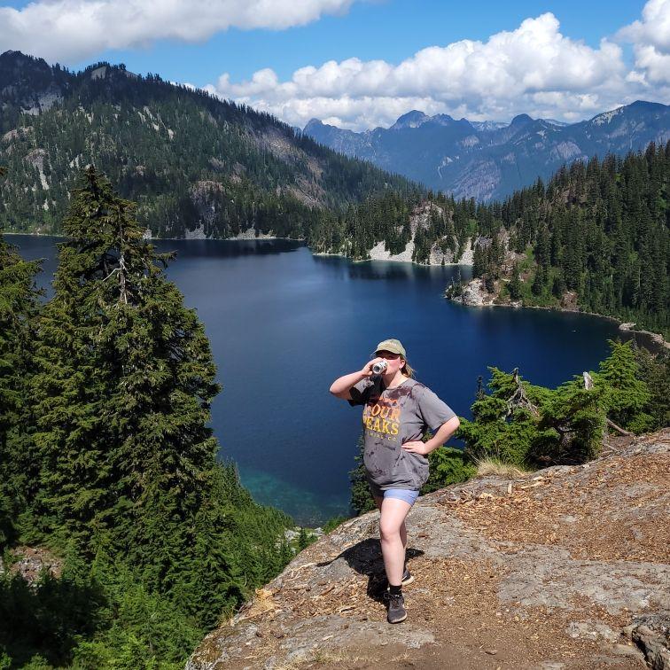 Drinking a crisp Rainier (snow lake, 2023)