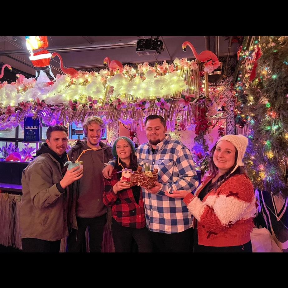 A responsible and respectable night in Detroit at Sippin’ Santa!
Pictured left to right are Alex (groomsman), Bob, Christine, Darrell (groomsman), and Sarah.
