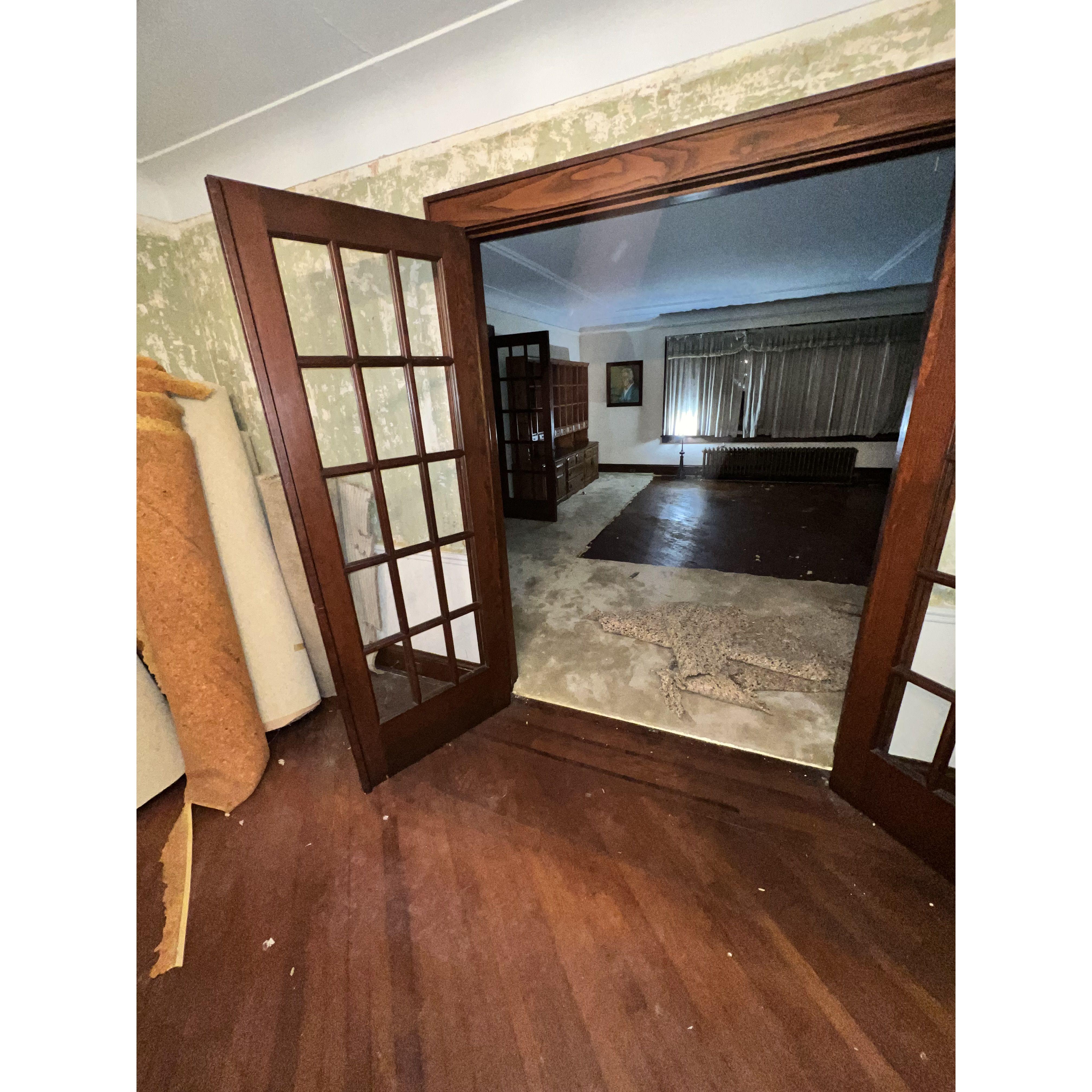 ripping out the carpet and removing wallpaper