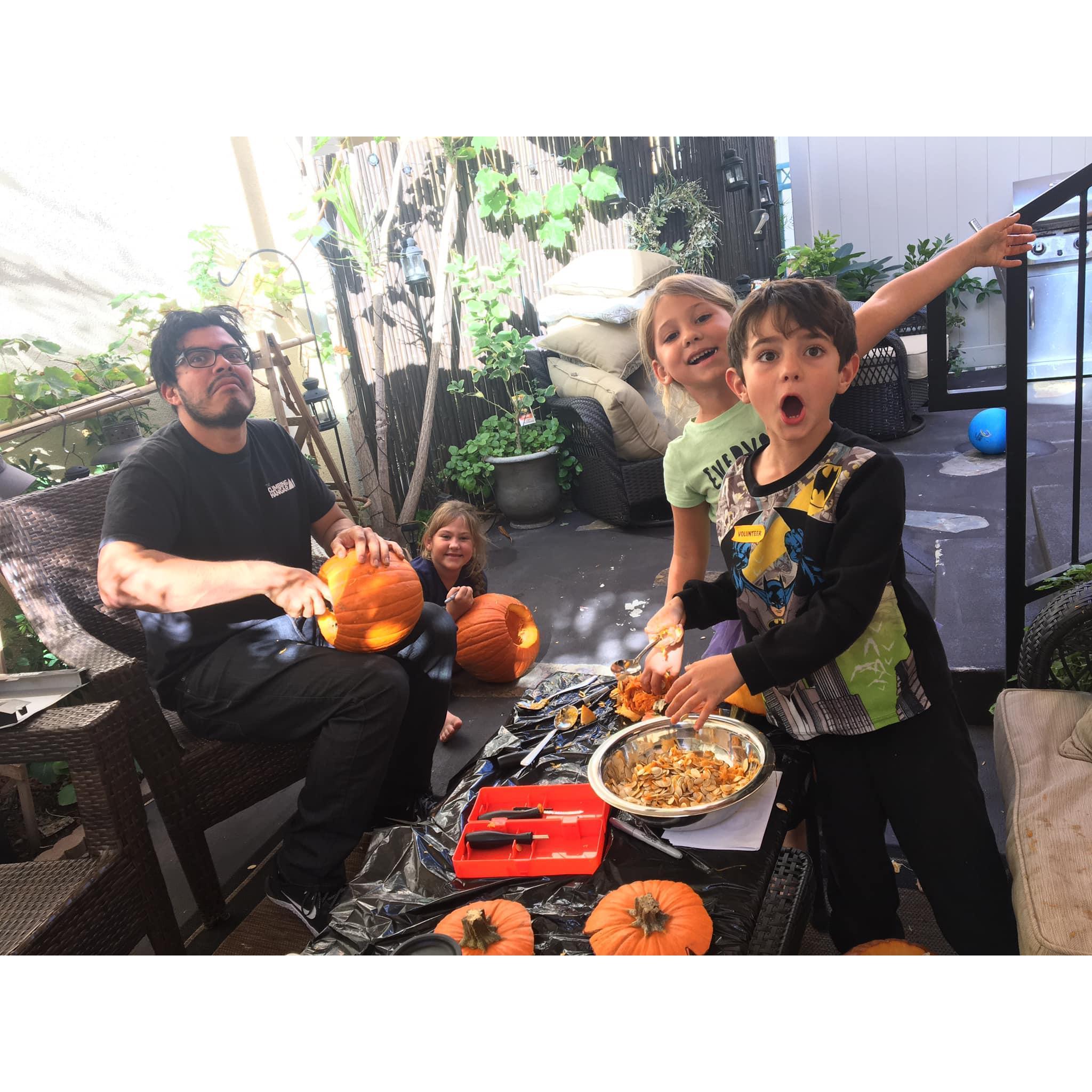 The time Ruben helped the littles carve pumpkins.
