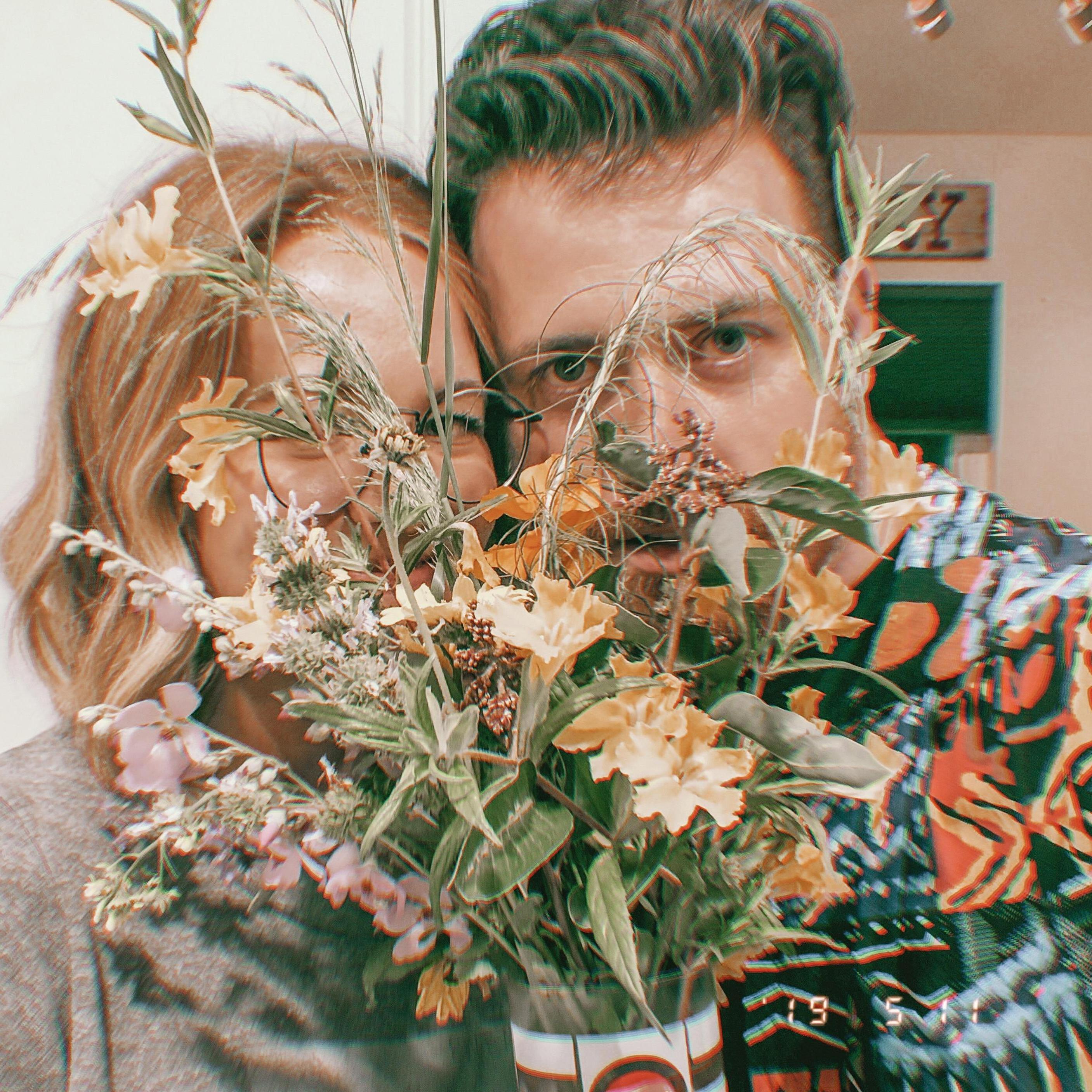 Our first photo with the wildflowers Dusty picked for me on a hike!

-Carlie