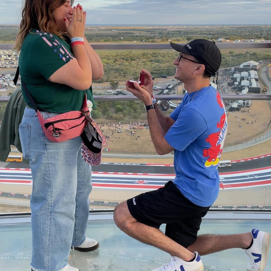 Arnold popped the question at COTA at the top of the observation deck overlooking the entire race track at golden hour.