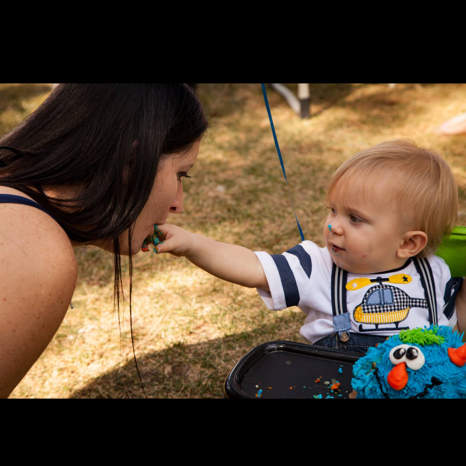 Henry feeding Auntie some of his cake