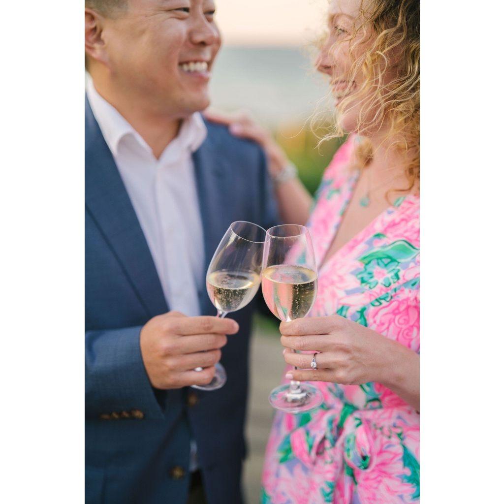 Cheers to our engagement! Taken at Steps Beach