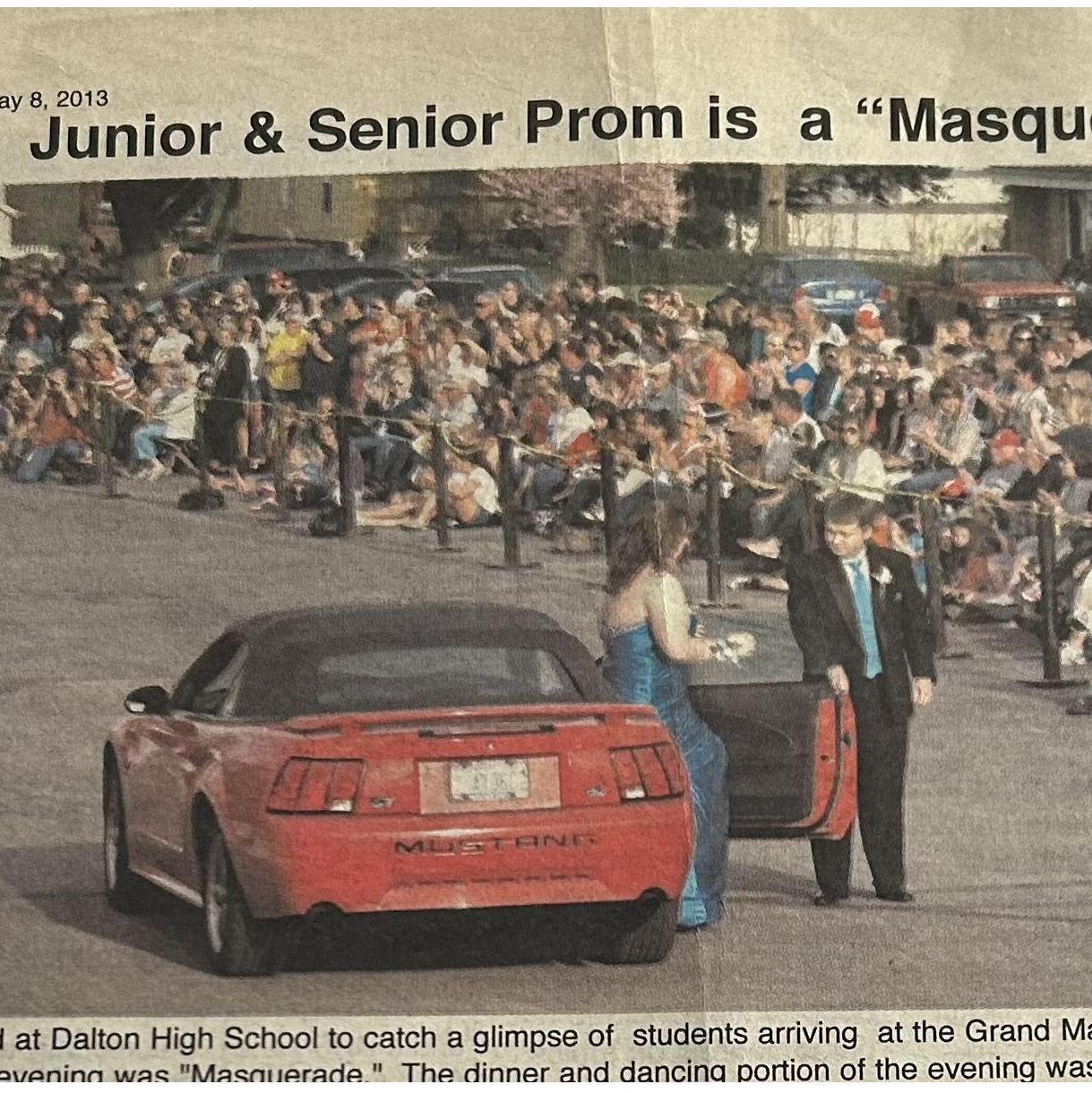 Blake helping Hannah out of his Grandpas mustang at grand march for prom. We made it into the paper!