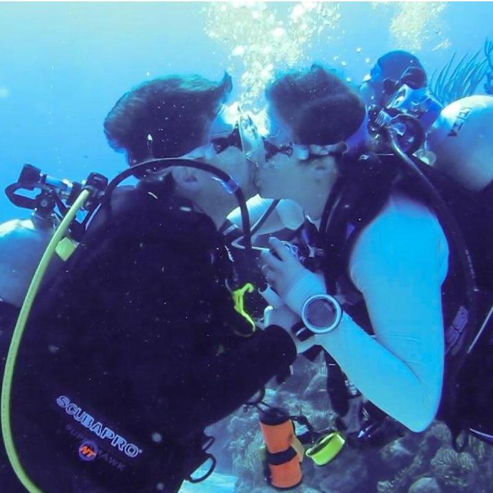 Underwater engagement at the Wilderness.  
He showed the ring, she nodded "yes"