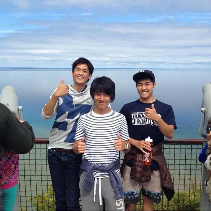 Naoto, Rikuo, Yong: A picture from the summer Hope College international student orientation. We enjoyed a refreshing bike ride around the island. (2014, Mackinac Island, MI)