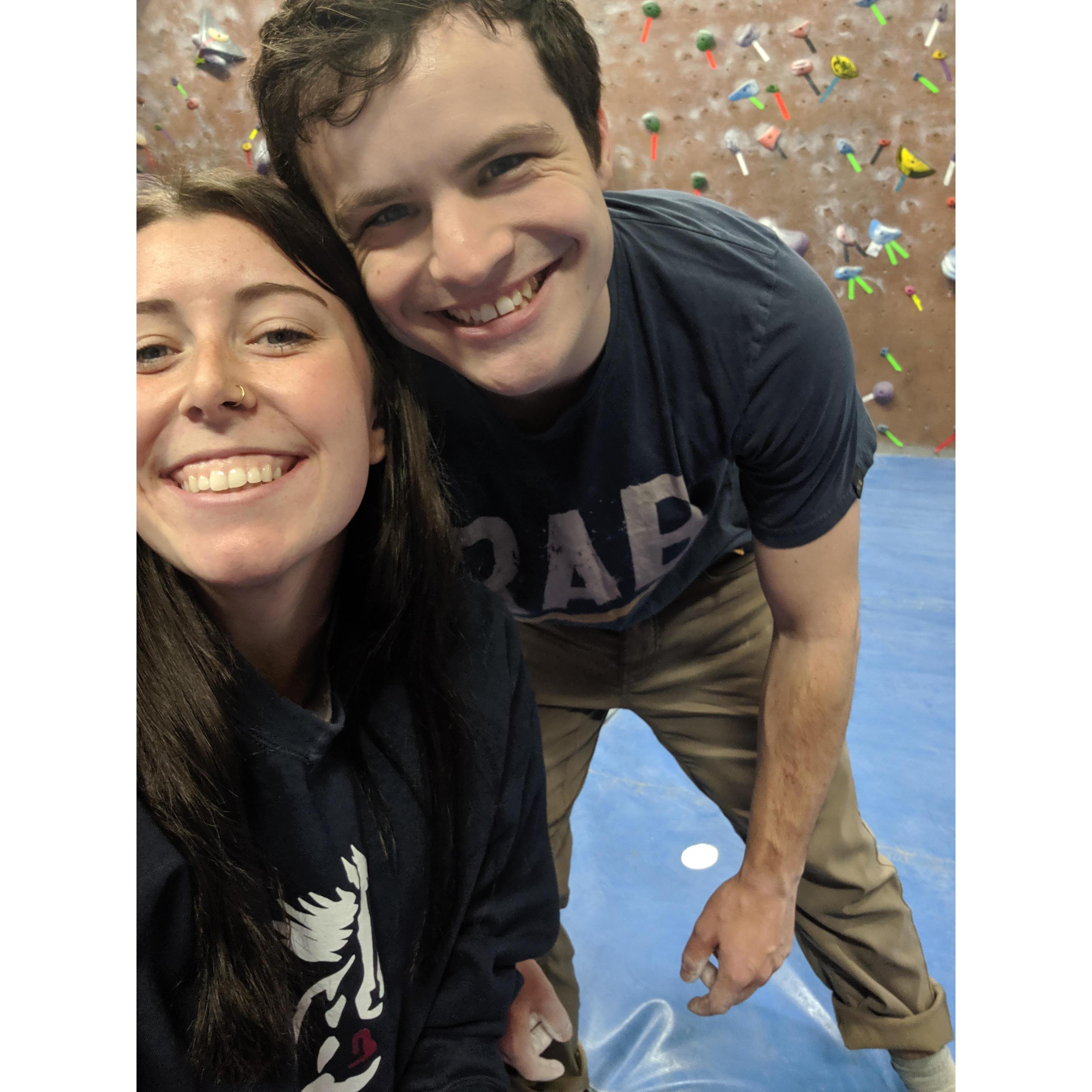 Teaching Mikayla climbing skills at the gym!