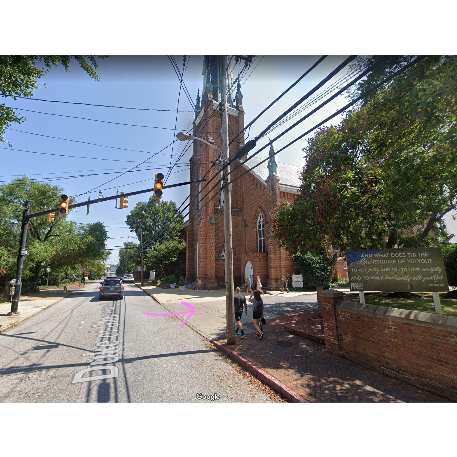 To enter the St Mary's Parking Lot, turn right at the light in front of the main church. 