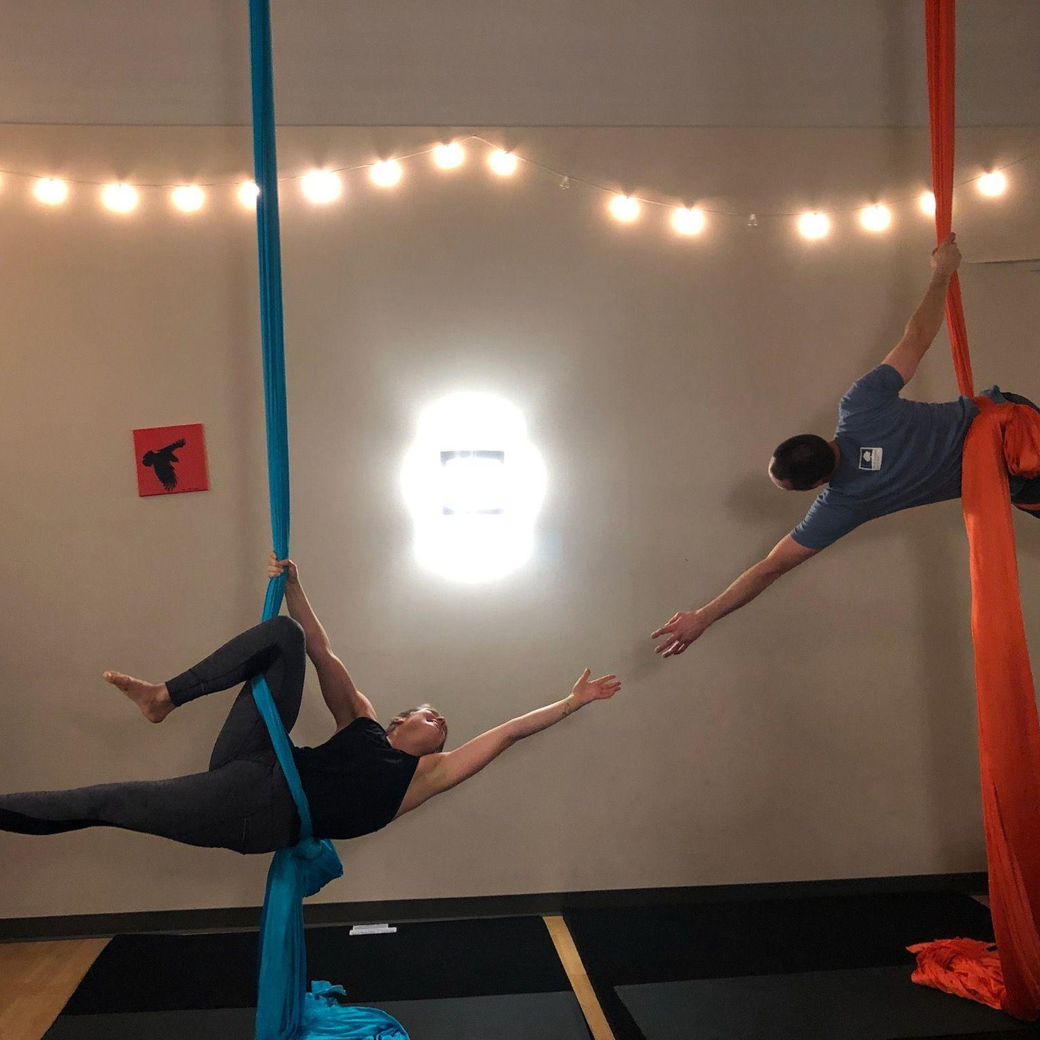 Our Creation of Adam moment during an aerial silks class.