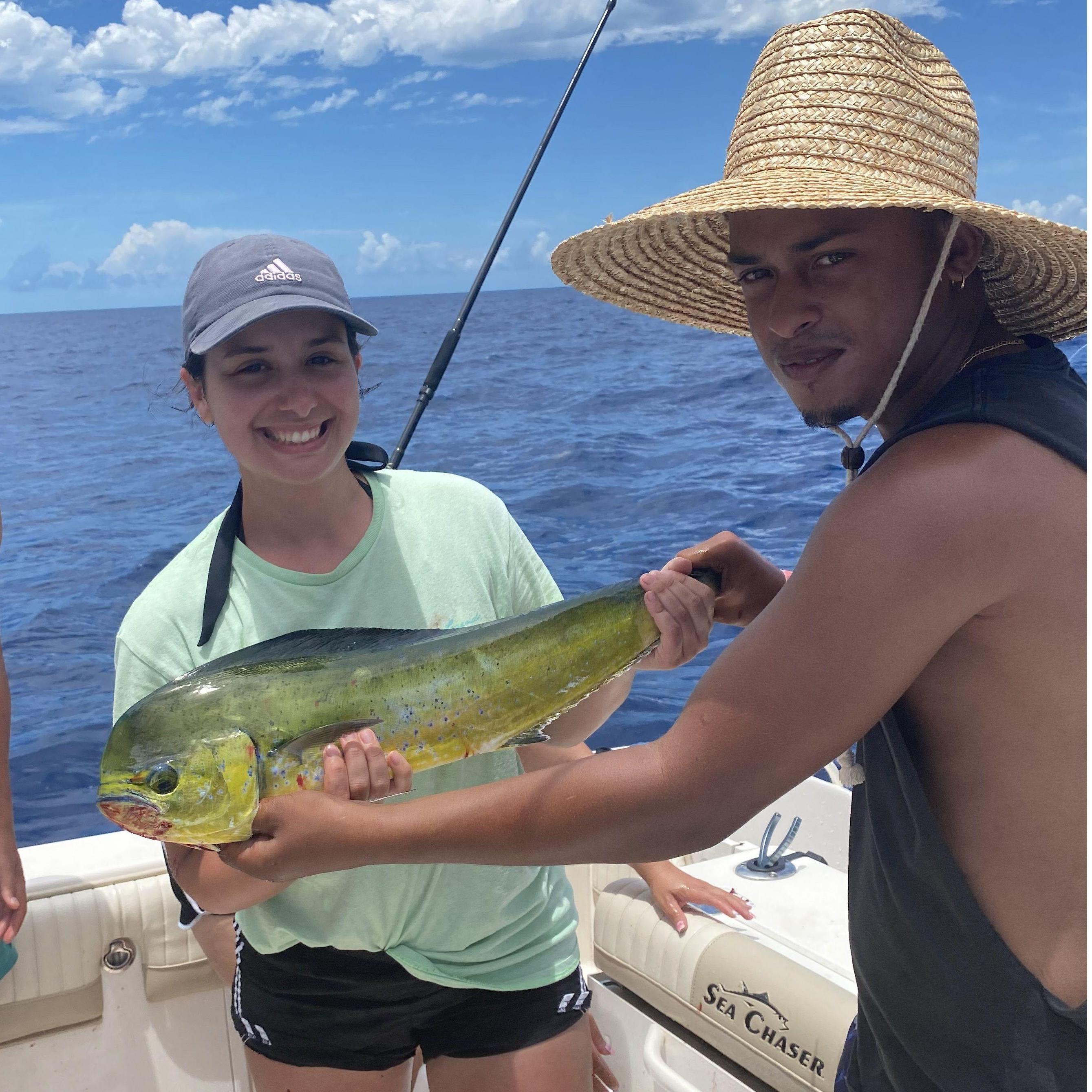 Our first picture together! The famous first Mahi Mahi Eliel helped Bianca catch!