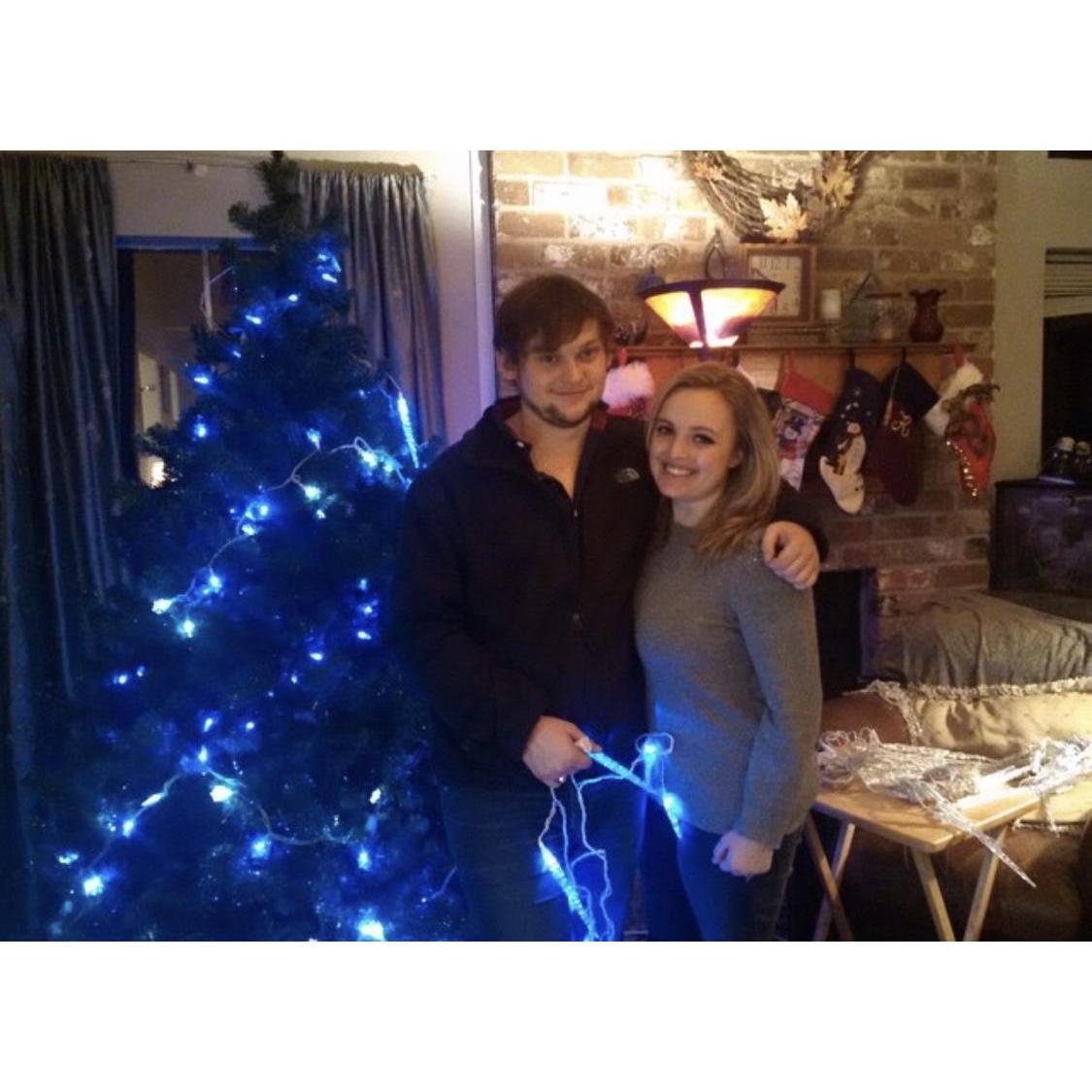 Decorating a Christmas tree during our very first Christmas together in 2014.