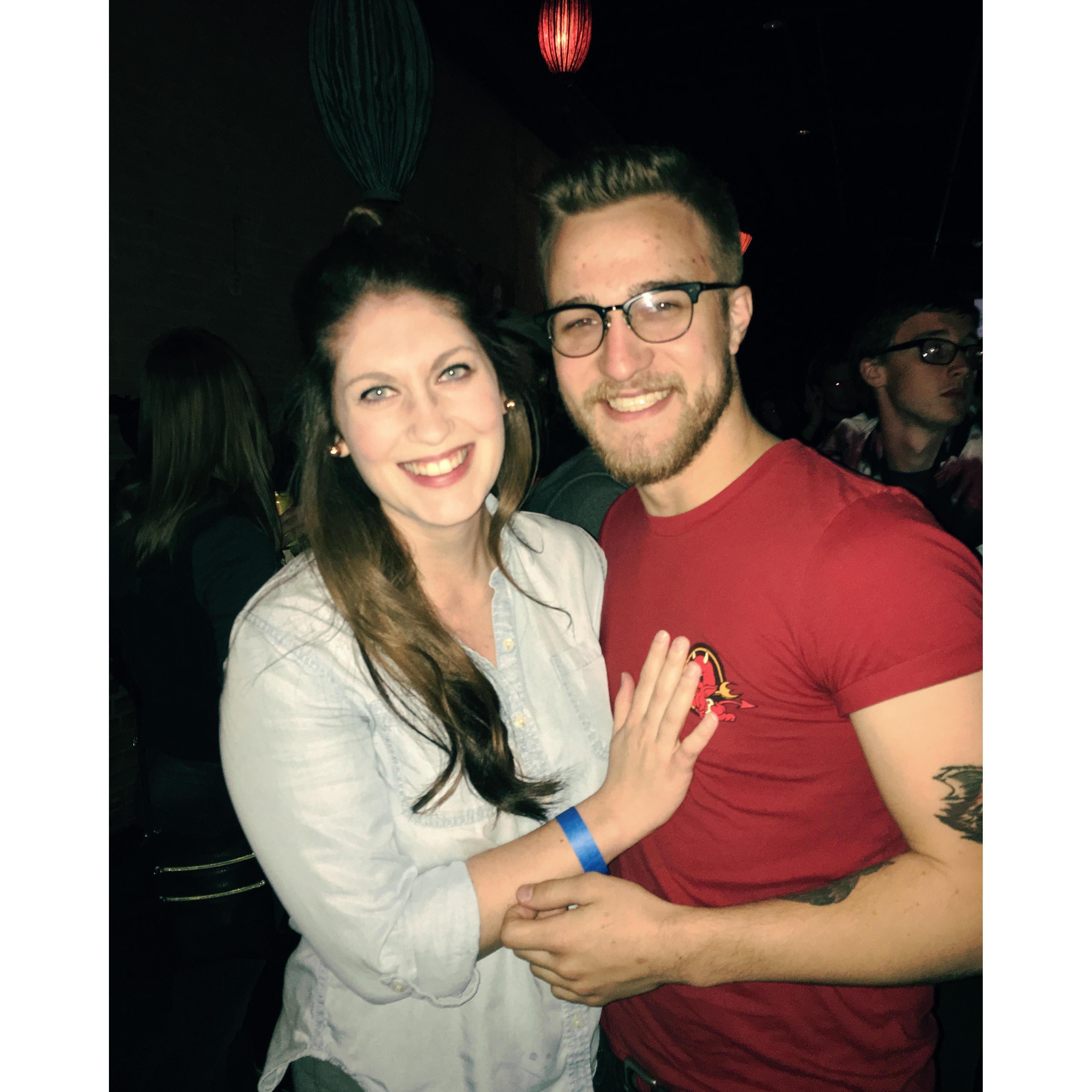 At a concert supporting a friend's band. Jayk protected Madeline from being stuck in a mosh pit.