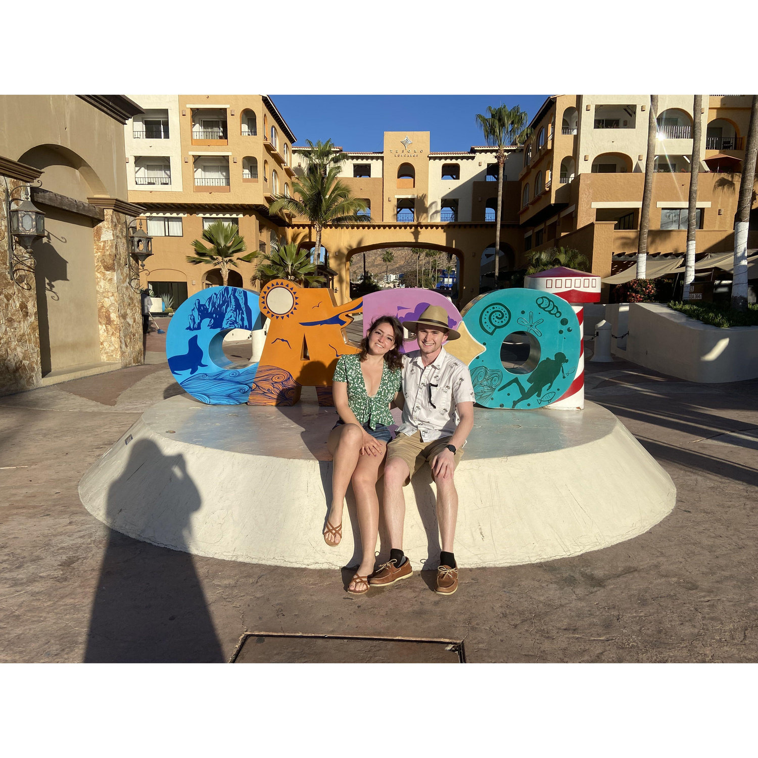 Our cliche tourist photo in front of the Cabo sign during our visit!