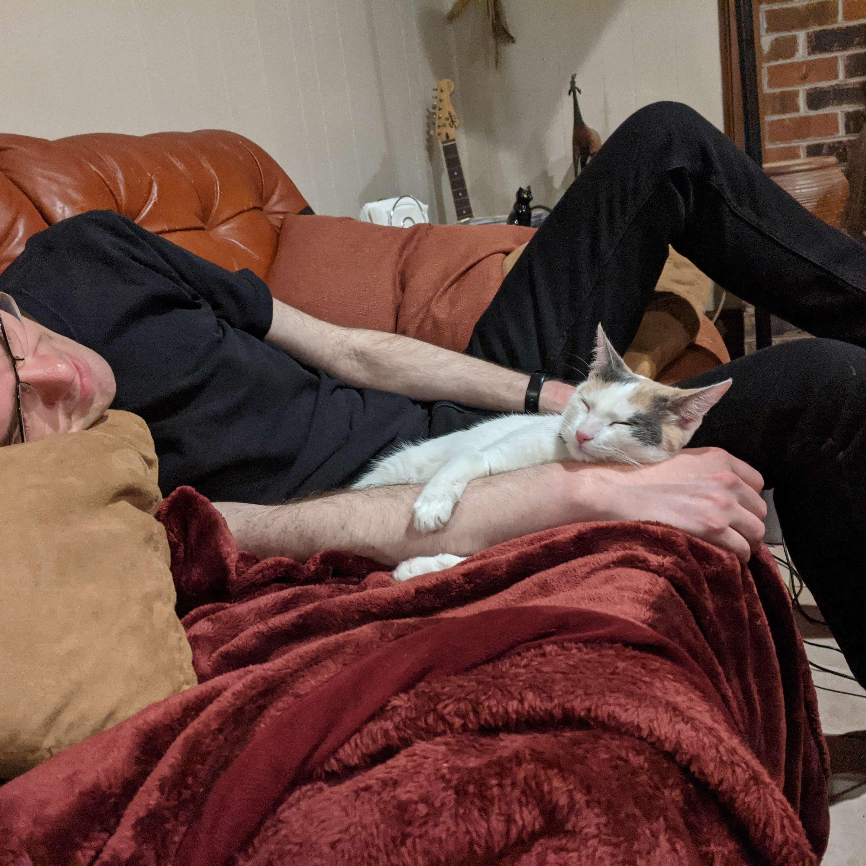 She's holding his arm with her little paws... Adorable. 