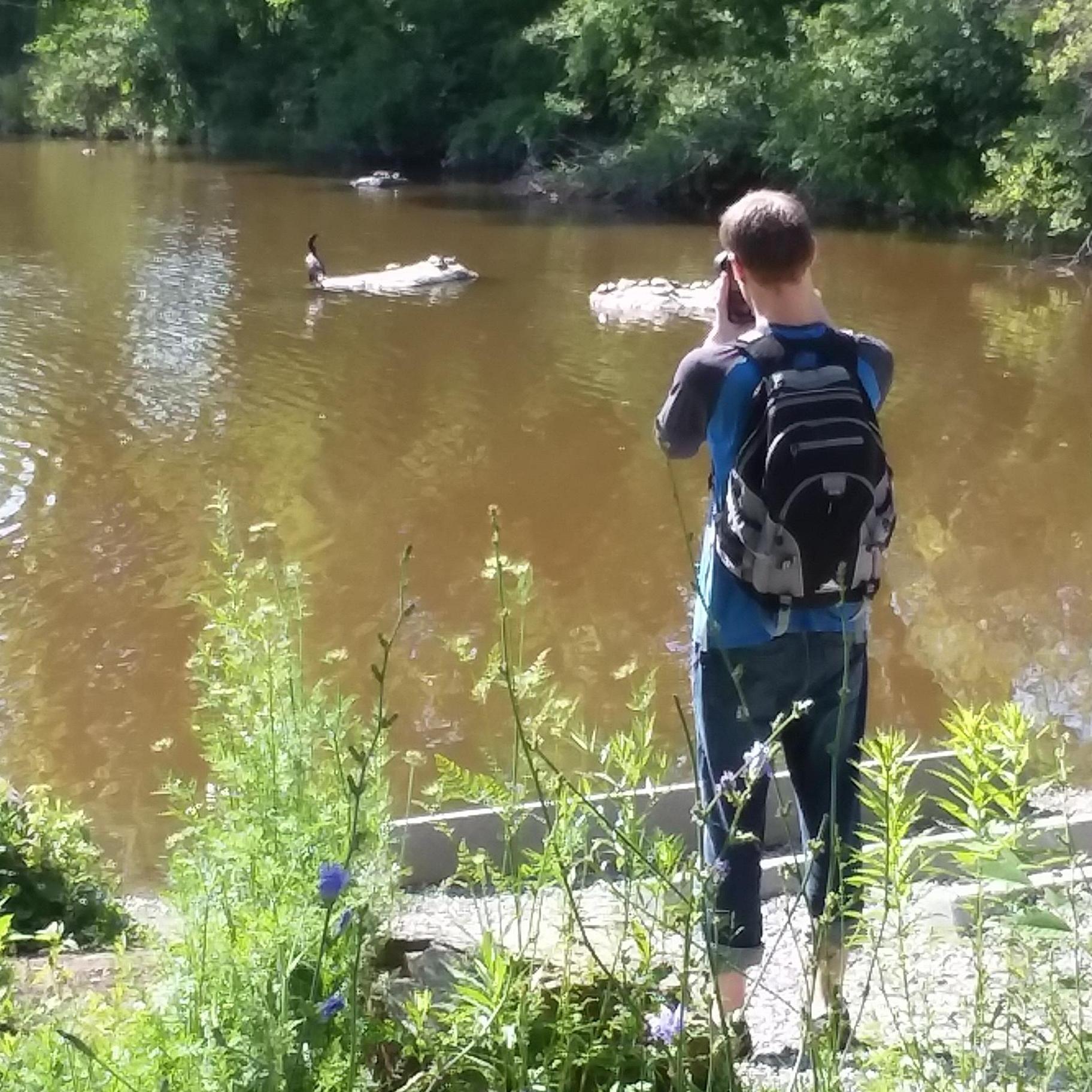Betsy watches Ryan watch birds