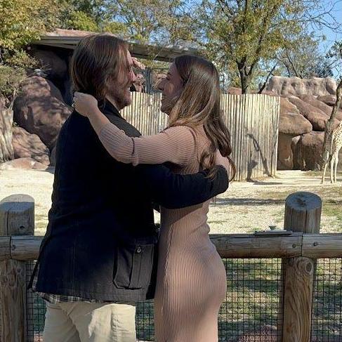 Brandon proposed in front of the giraffes (Michaella's favorite)!