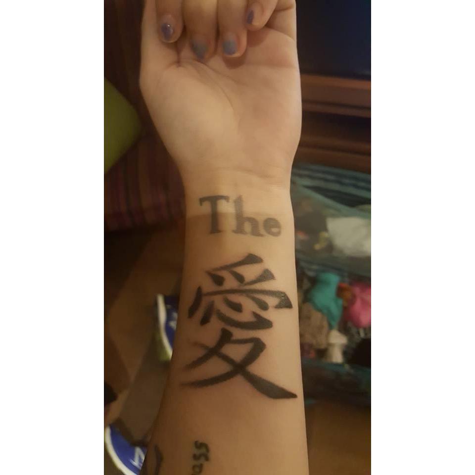We both have matching tattoos. It means "Love" in Japanese.