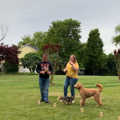 Playing Kubb at the house while family was visiting. May 2023.