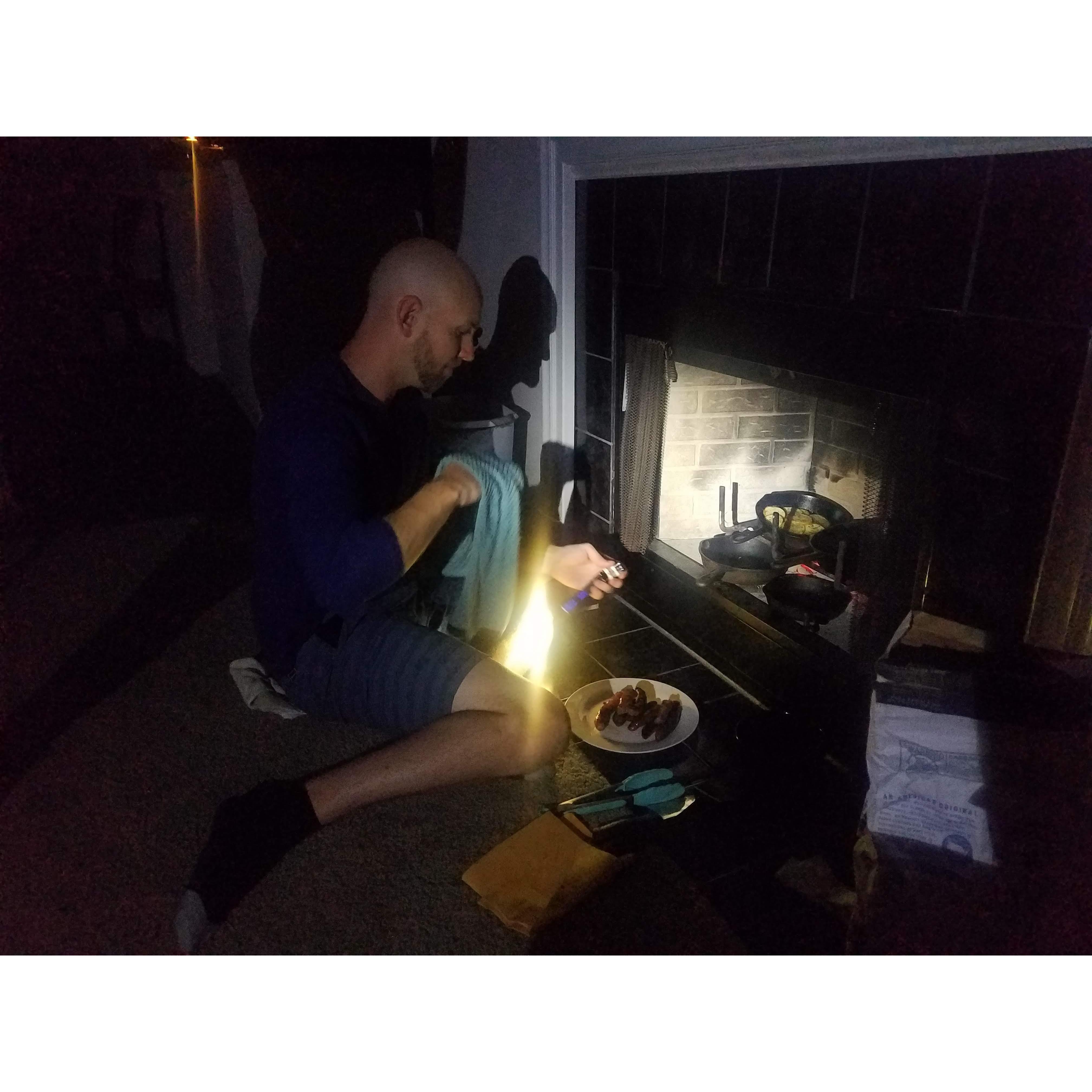 Cooking over fireplace with our friends Alberto and Cece after Hurricane Sally hit.