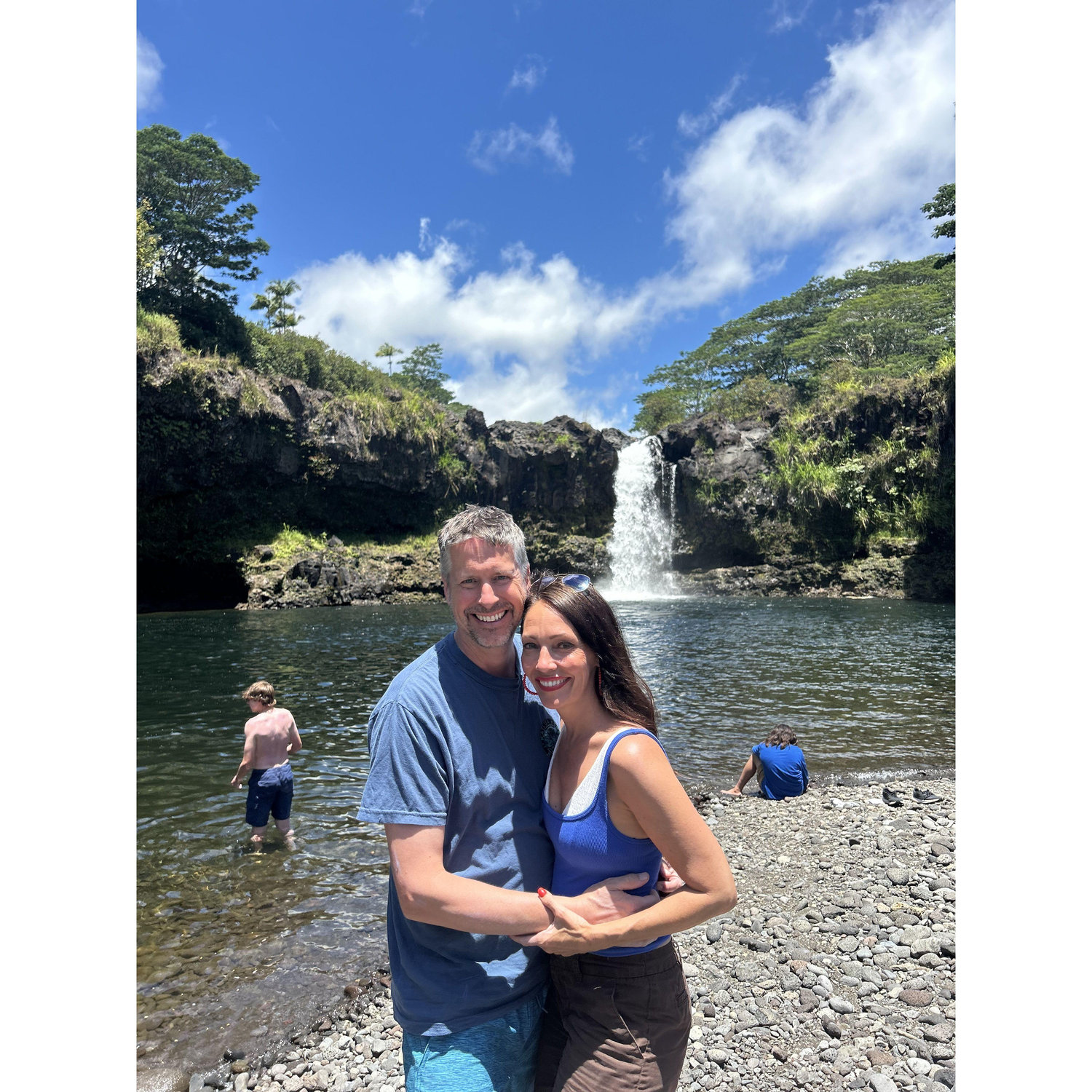 about to go swim in a pool under a HA waterfall