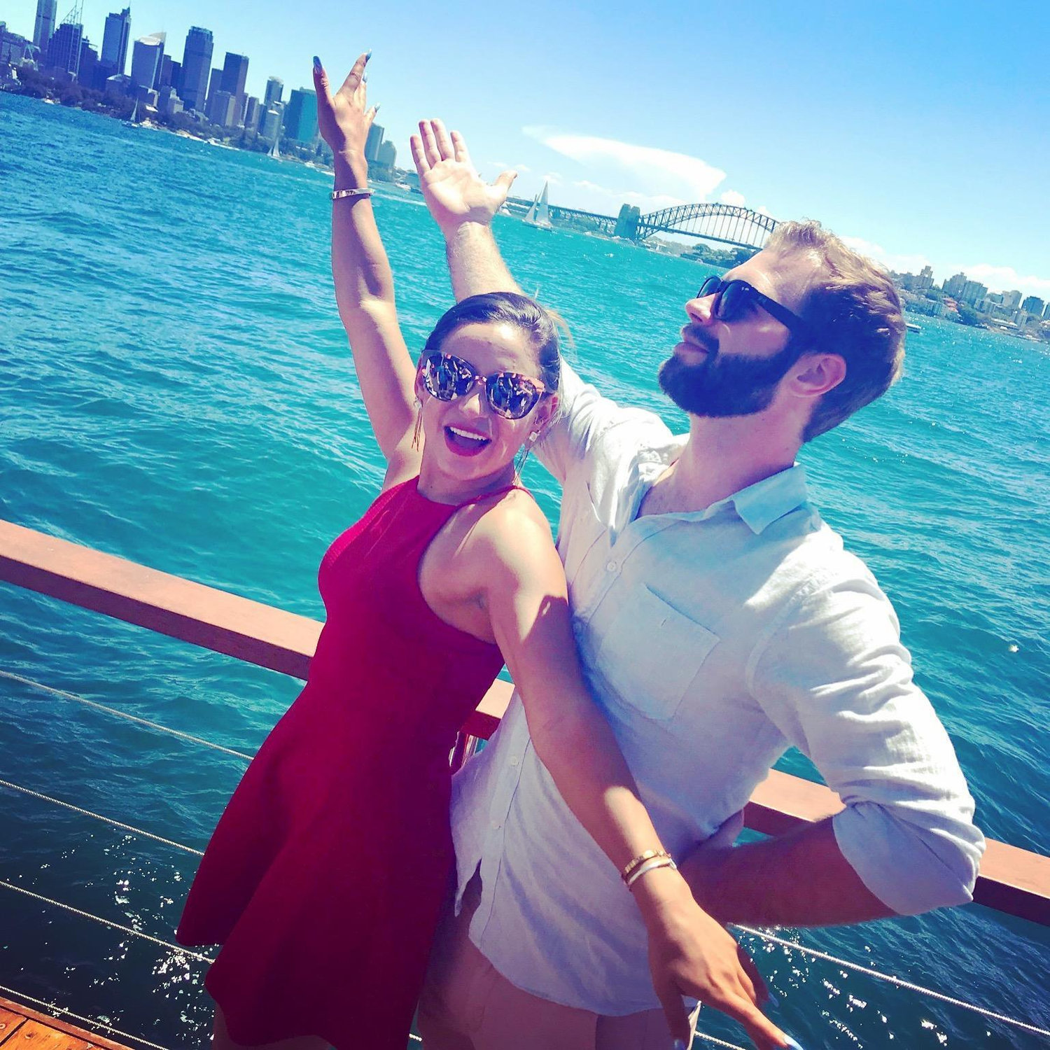 Denny singing, "I can show you the world" while in the Sydney harbor.
