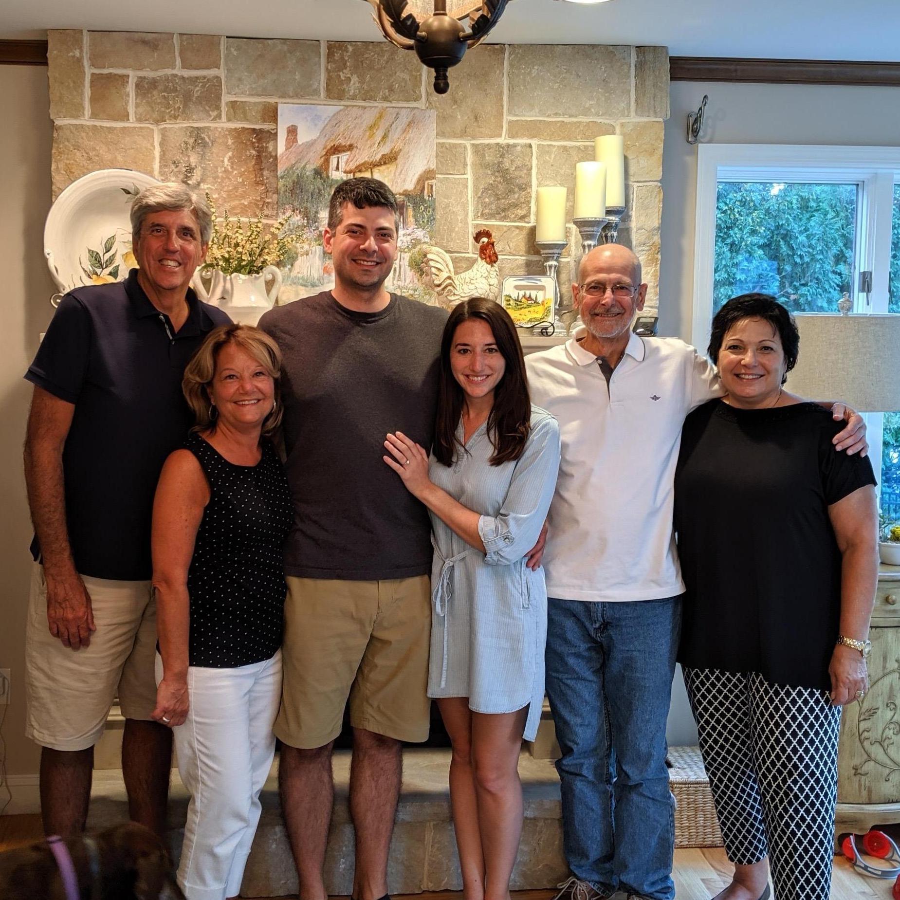 Our loving parents celebrating our engagement with us.