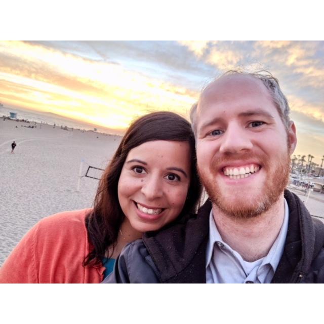 Lovely date enjoying the Sunset on the beach.