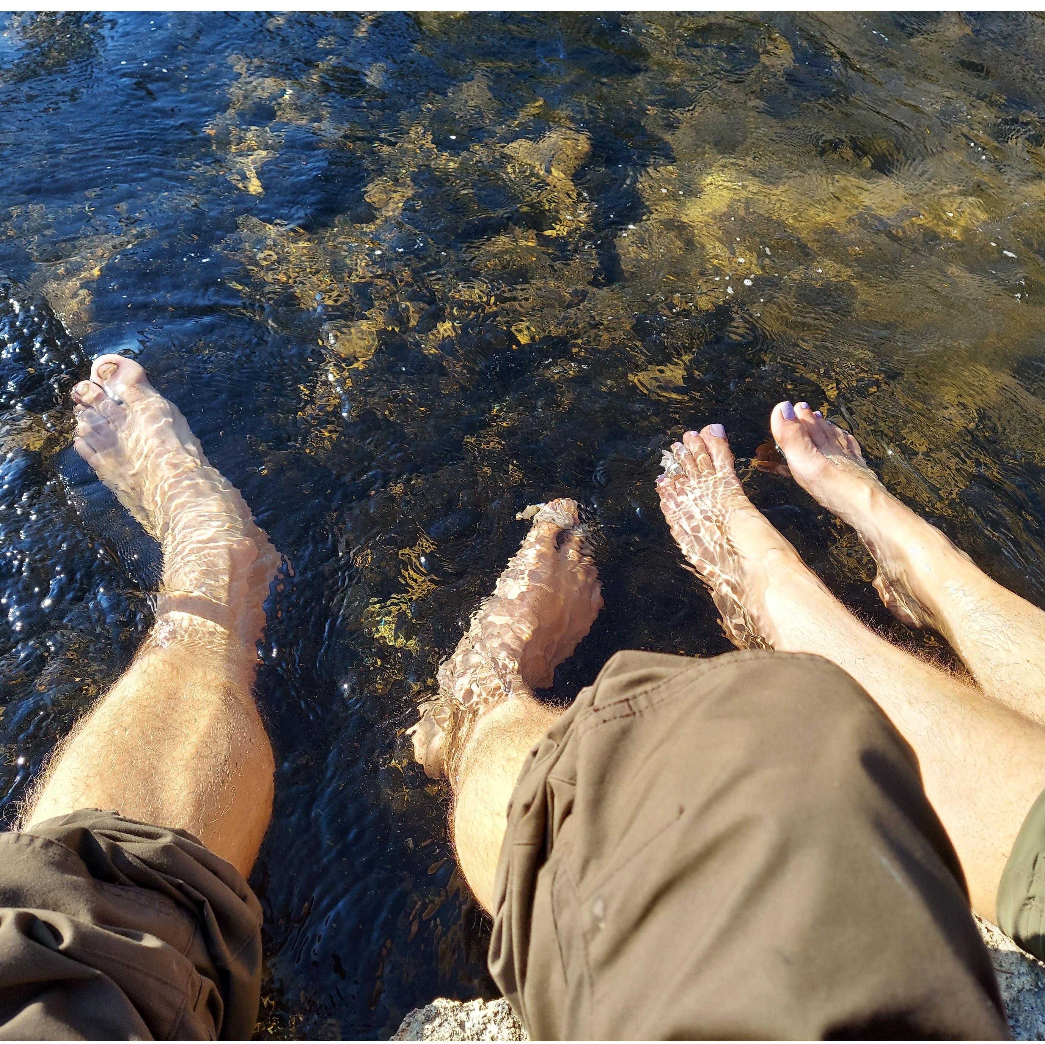 Soaking our feet in a creek fed by thermally heated water.