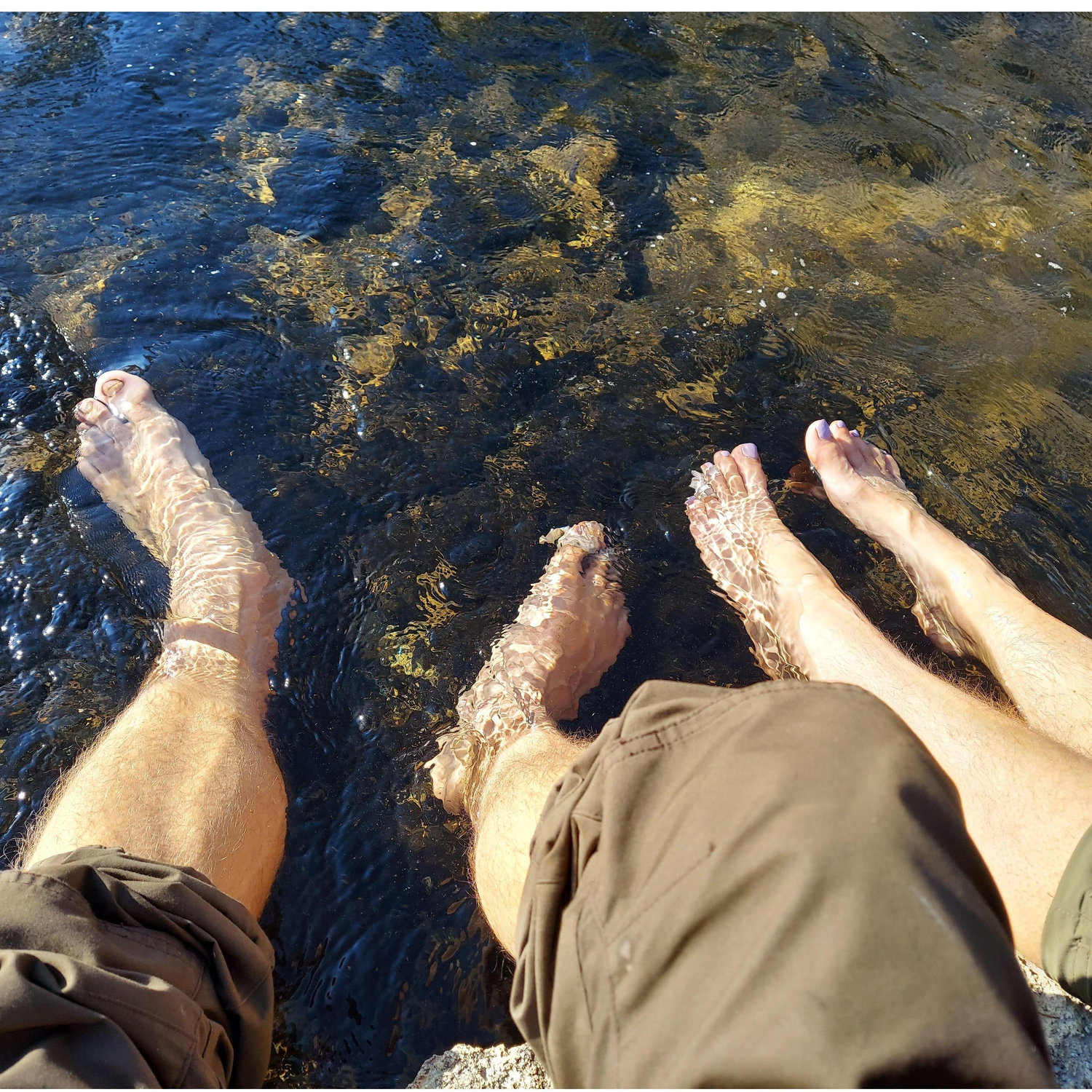 Soaking our feet in a creek fed by thermally heated water.