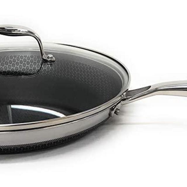 HexClad Revolutionary Laser Etched Hybrid Technology Cookware, Non-Stick Interior and Exterior, Stainless Steel with Aluminum Core, with Tempered Glass Lid, Works on All Cooktops (12" Saute Pan)