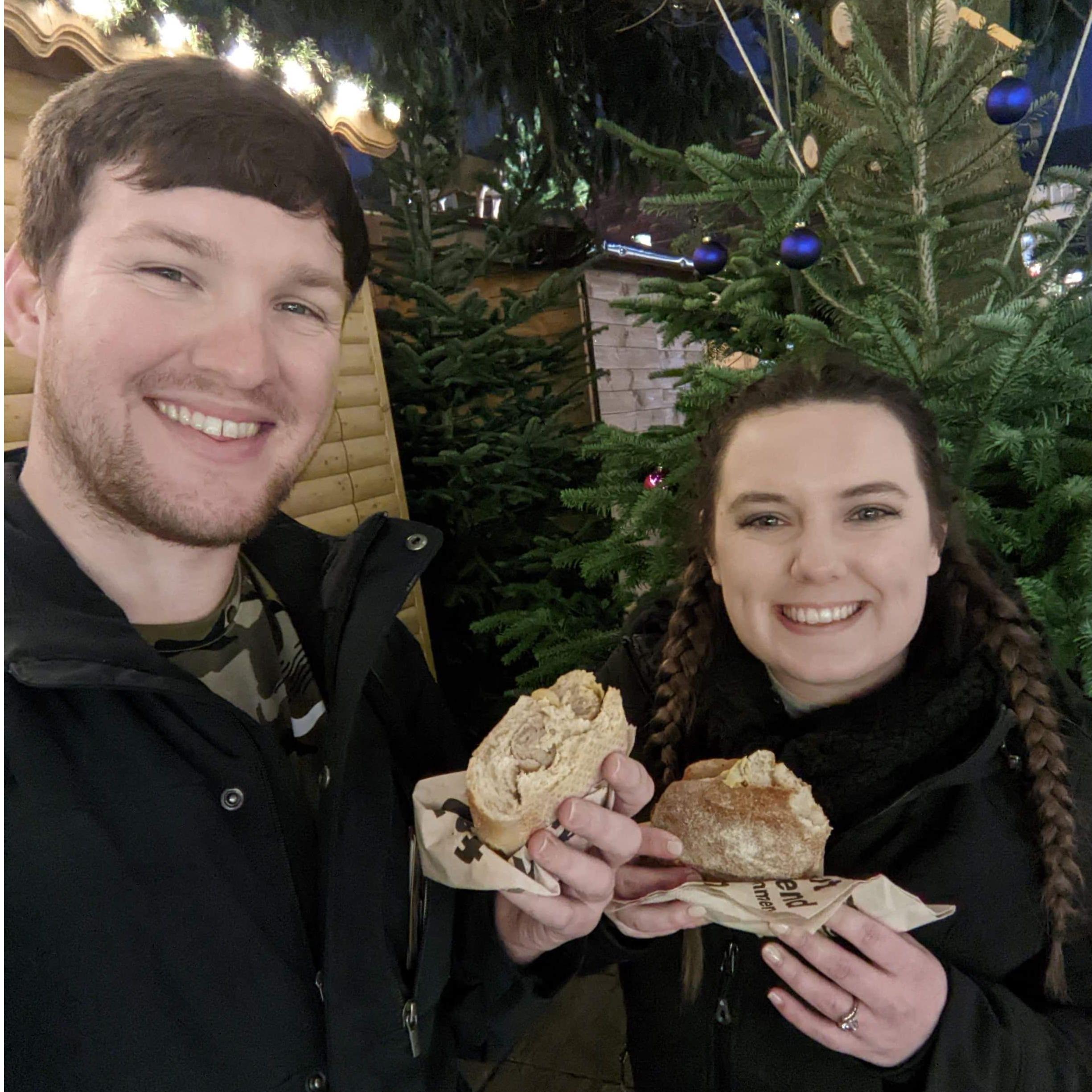 Newly engaged munching on some brats (?) (Wurzburg, Germany)
