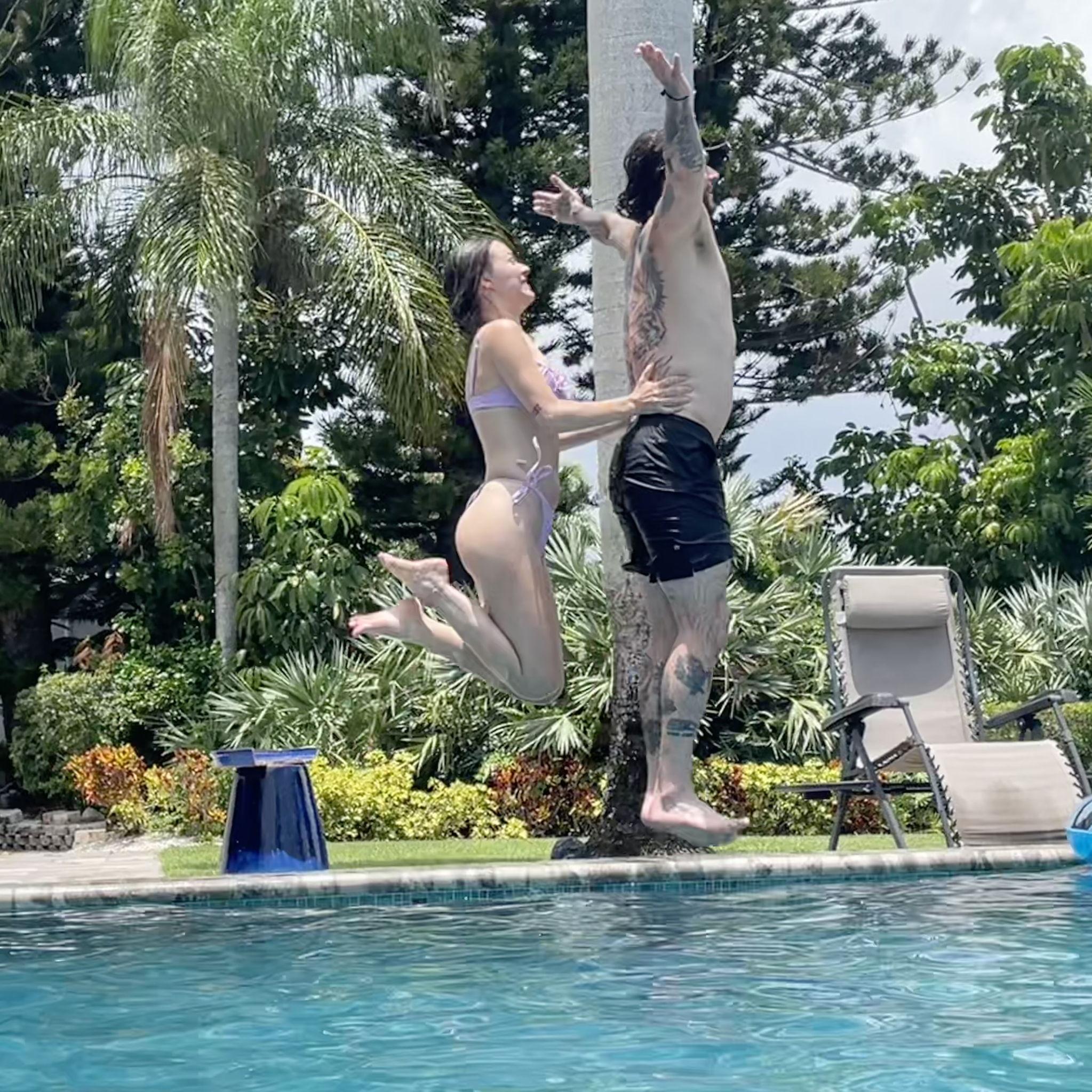 Jumping gracefully into the pool during a family vacation