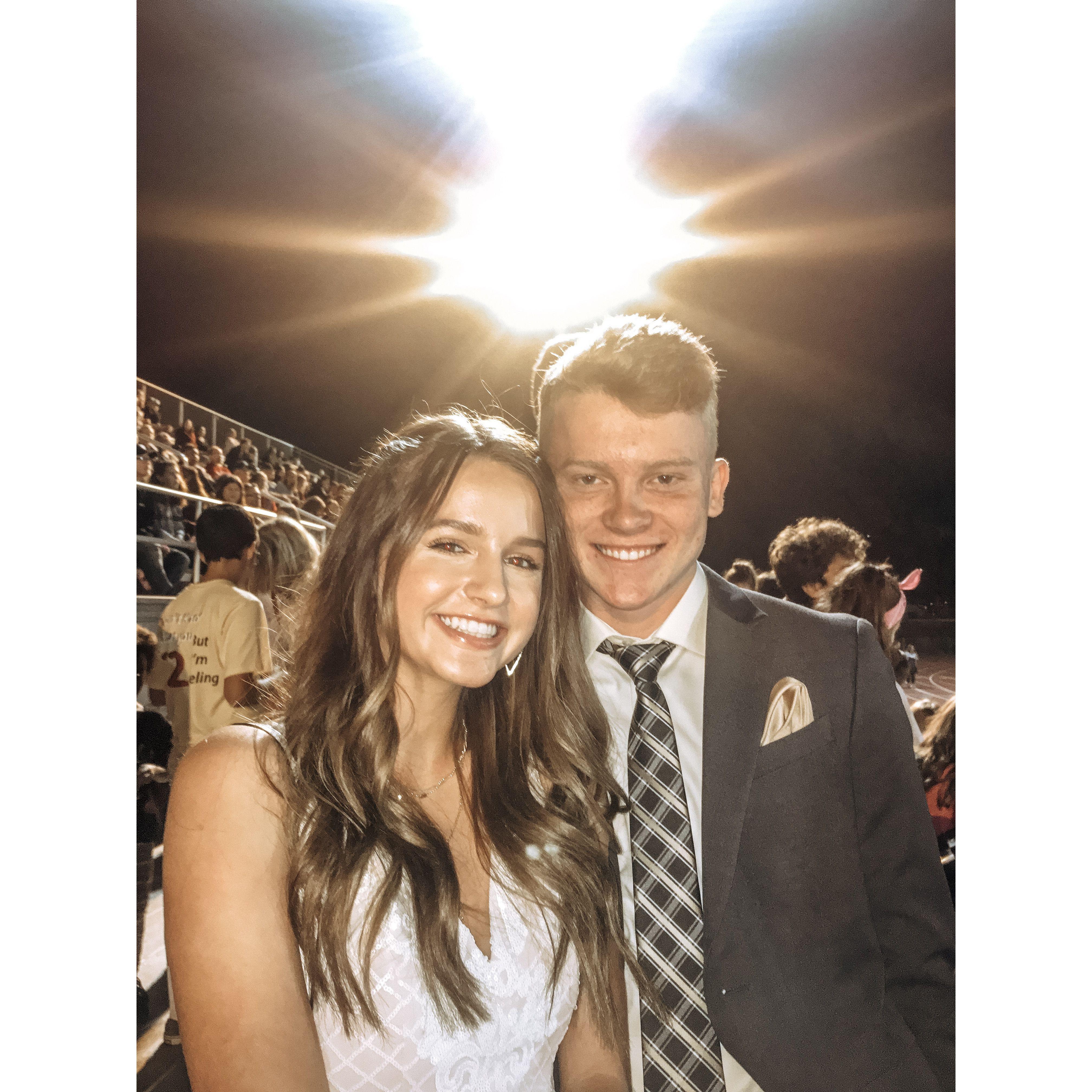 At the homecoming football game! We were on the homecoming court! We lost.
