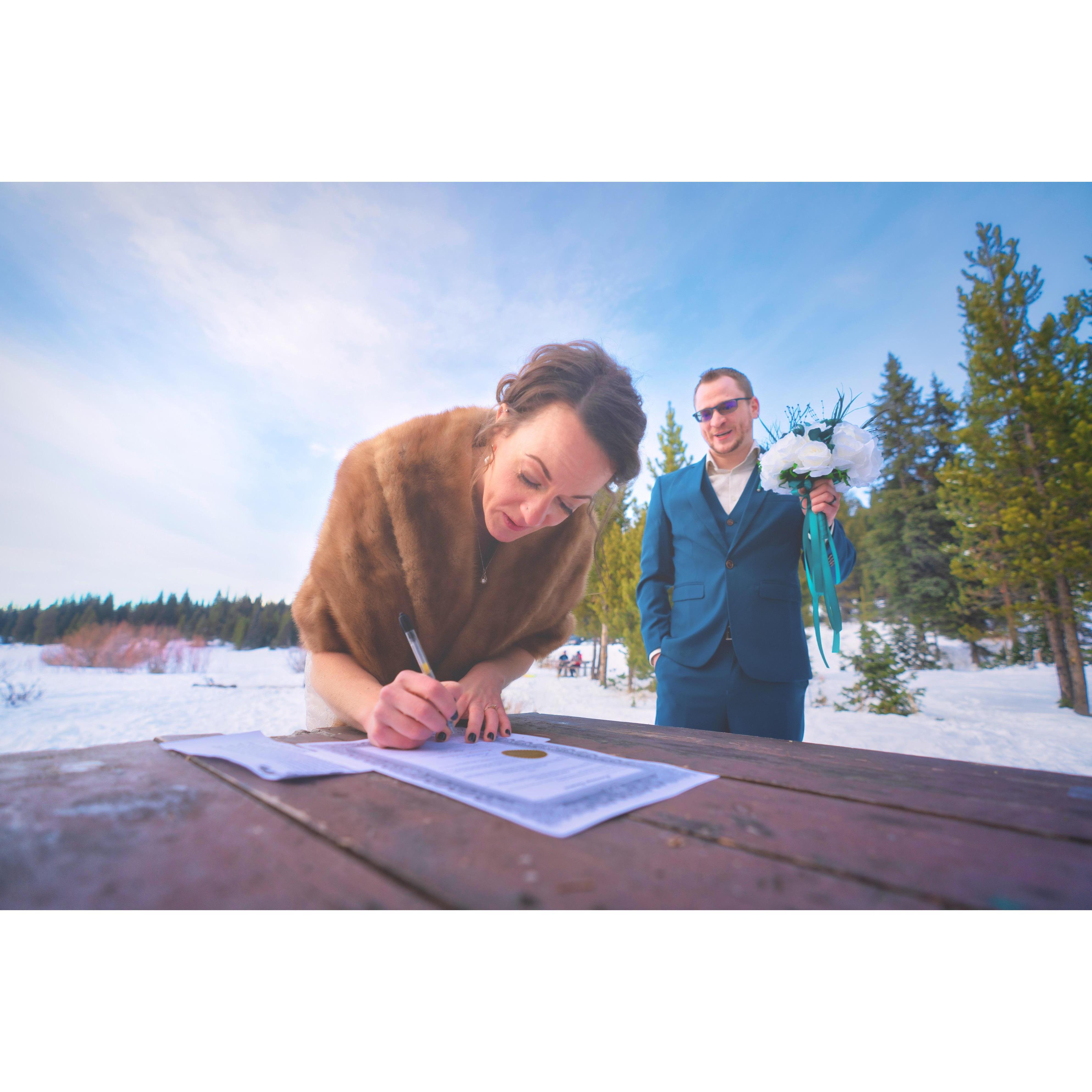 Heather trying to figure out how to sign her new name!