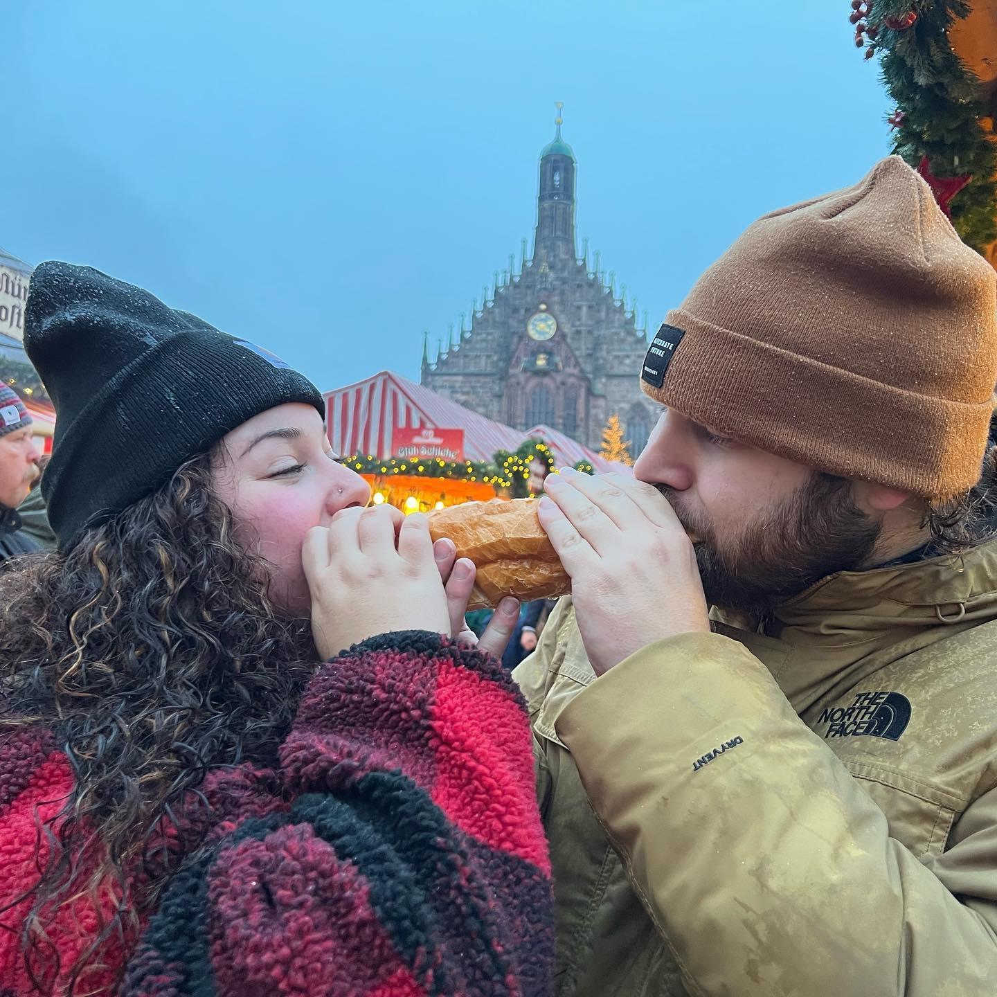 Sharing bratwurst in Nuremberg, Germany. Lady and the Tramp style!