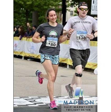 Crossing the finish line of the Madison half marathon, May 2016