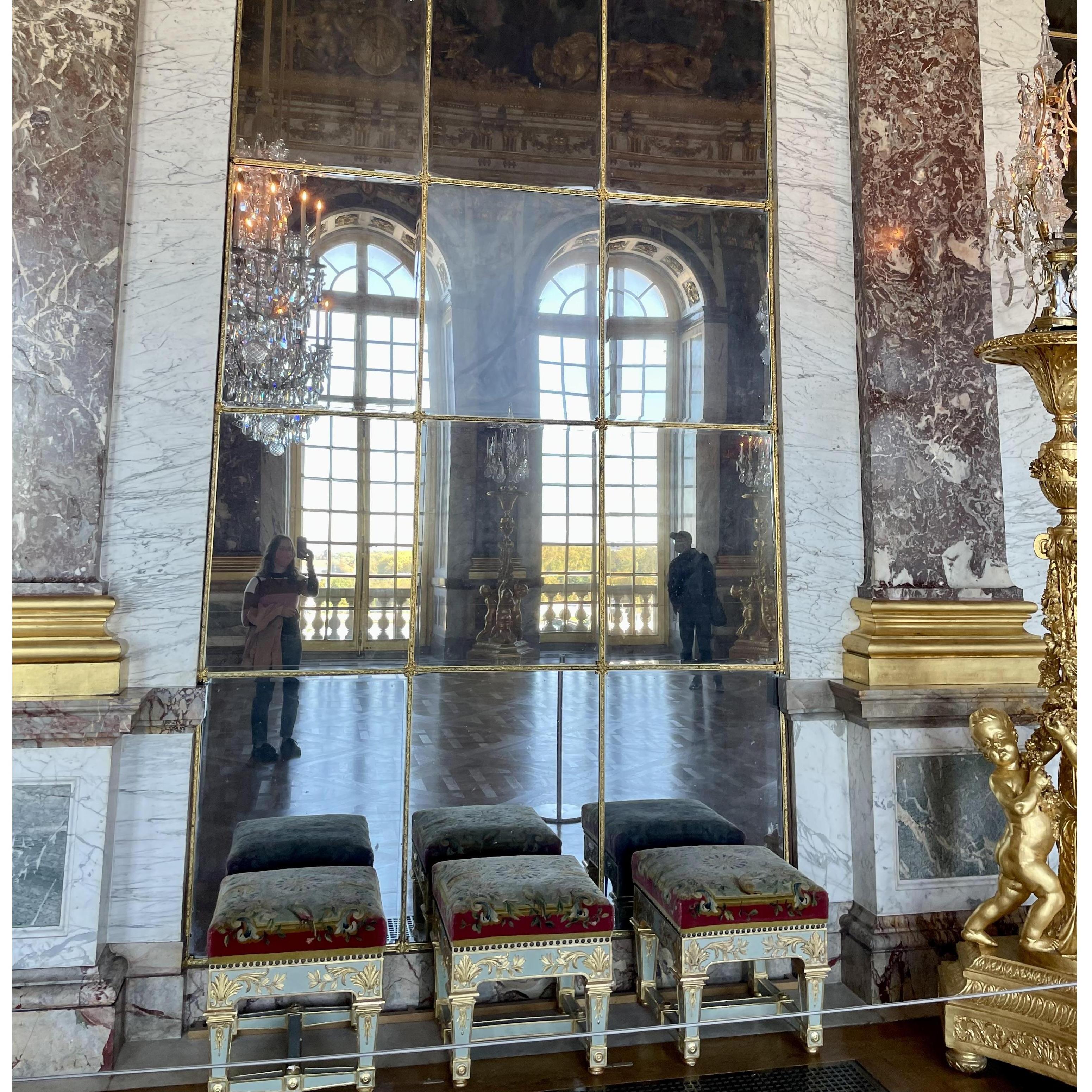 Reflecting on history at Versailles Palace, France.