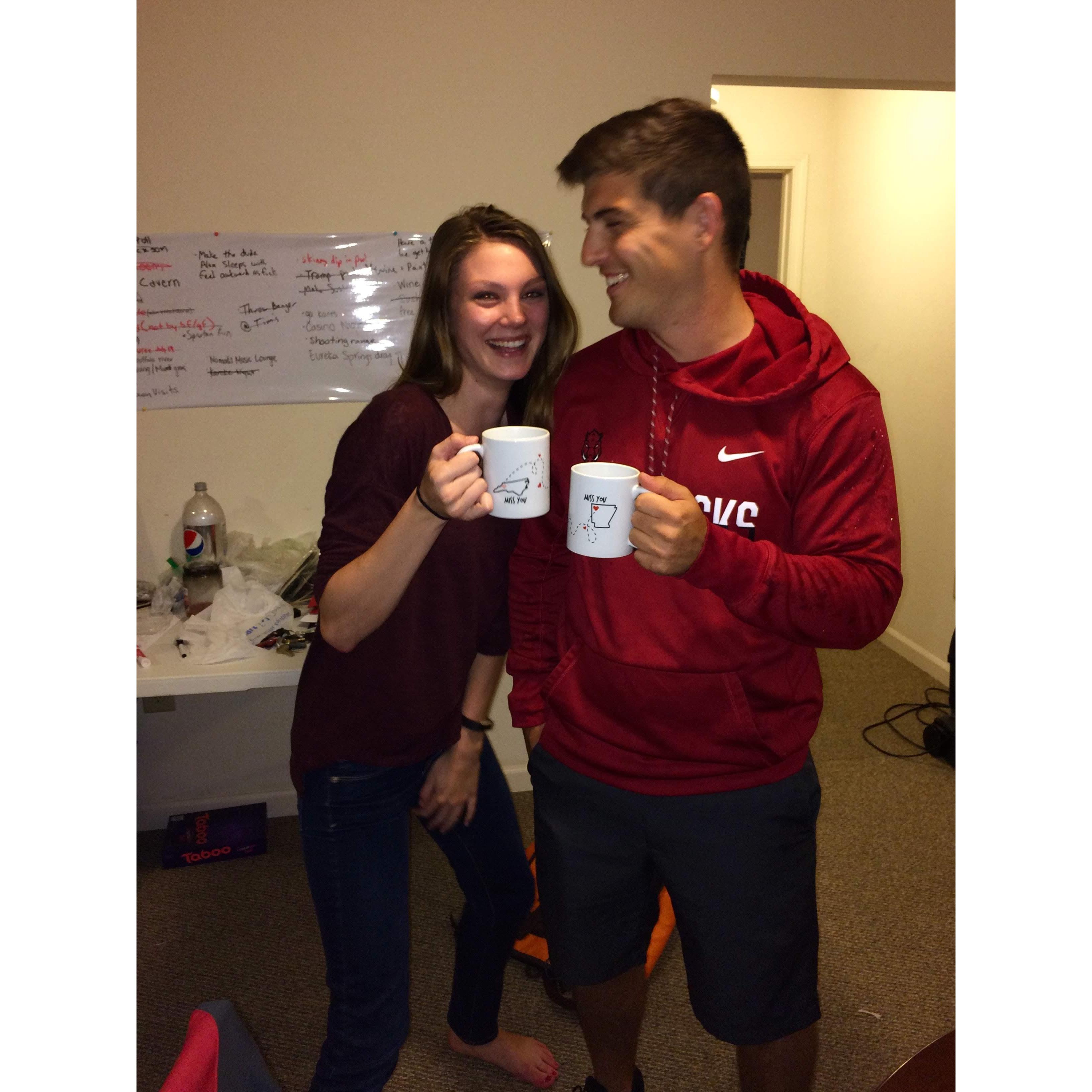 Showing off our long-distance mugs