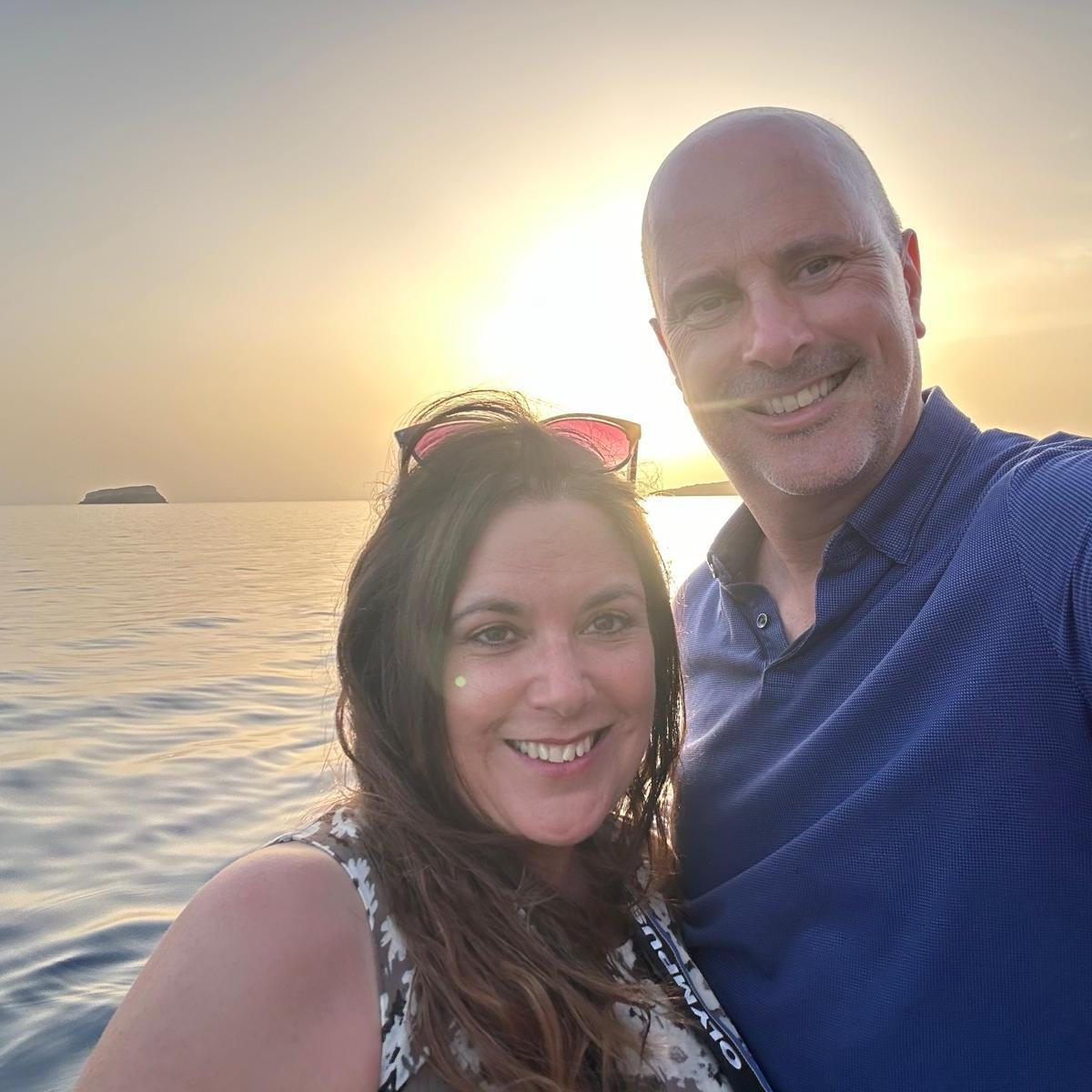 A romantic Santorini sunset on a boat