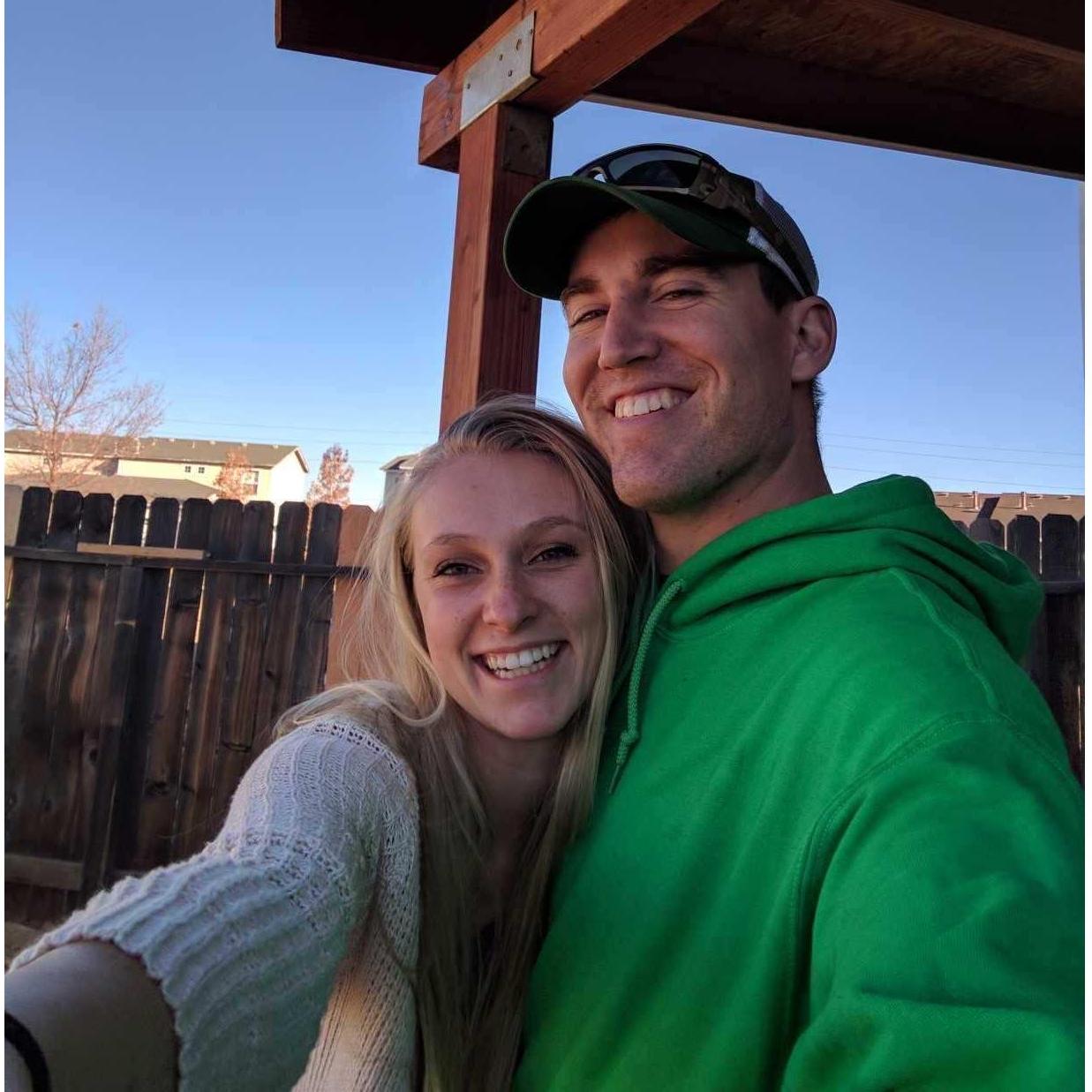 Our first (decent) picture together, taken in the backyard of the first house we shared.